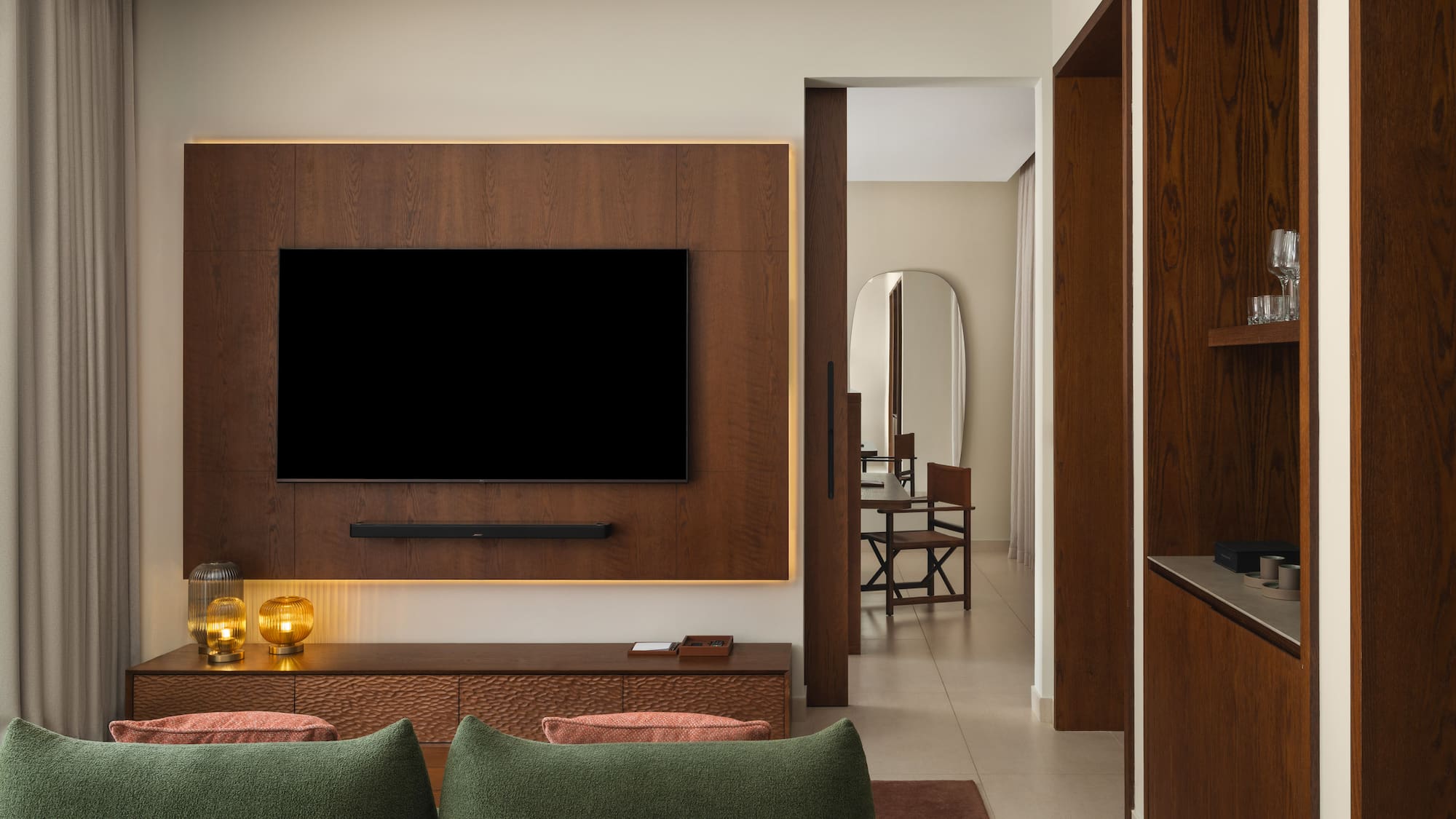 a living room with a tv on the wall