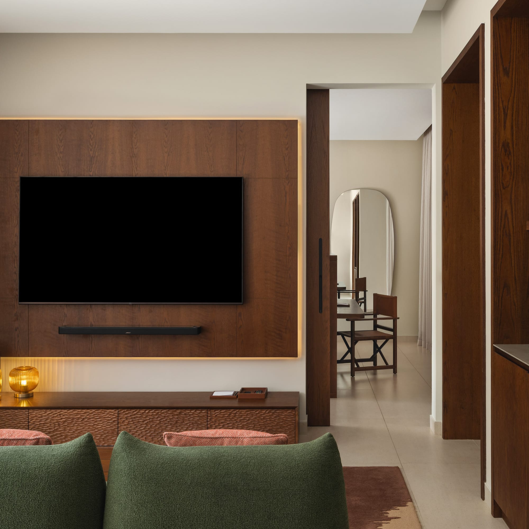 a living room with a tv on the wall