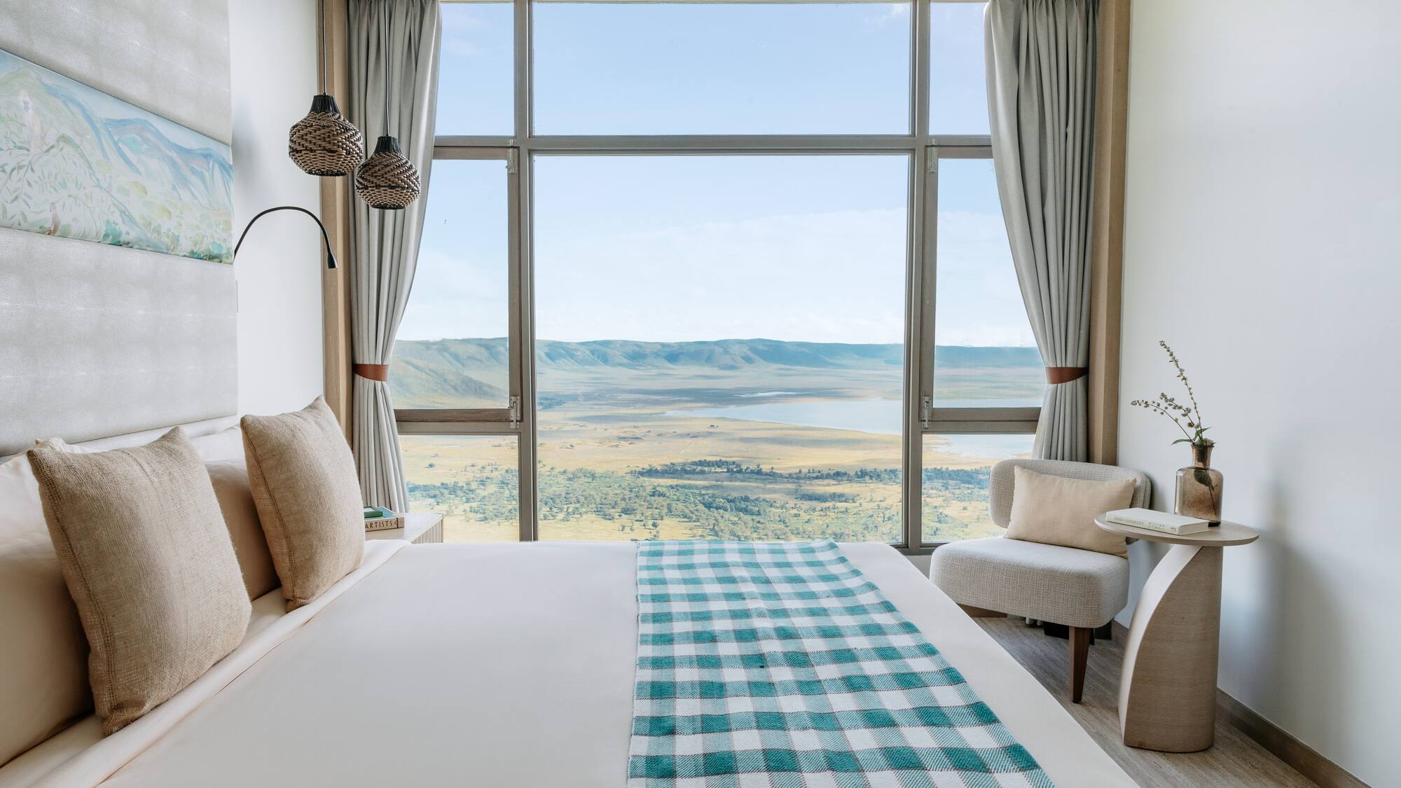 a room with a bed and a view of the valley
