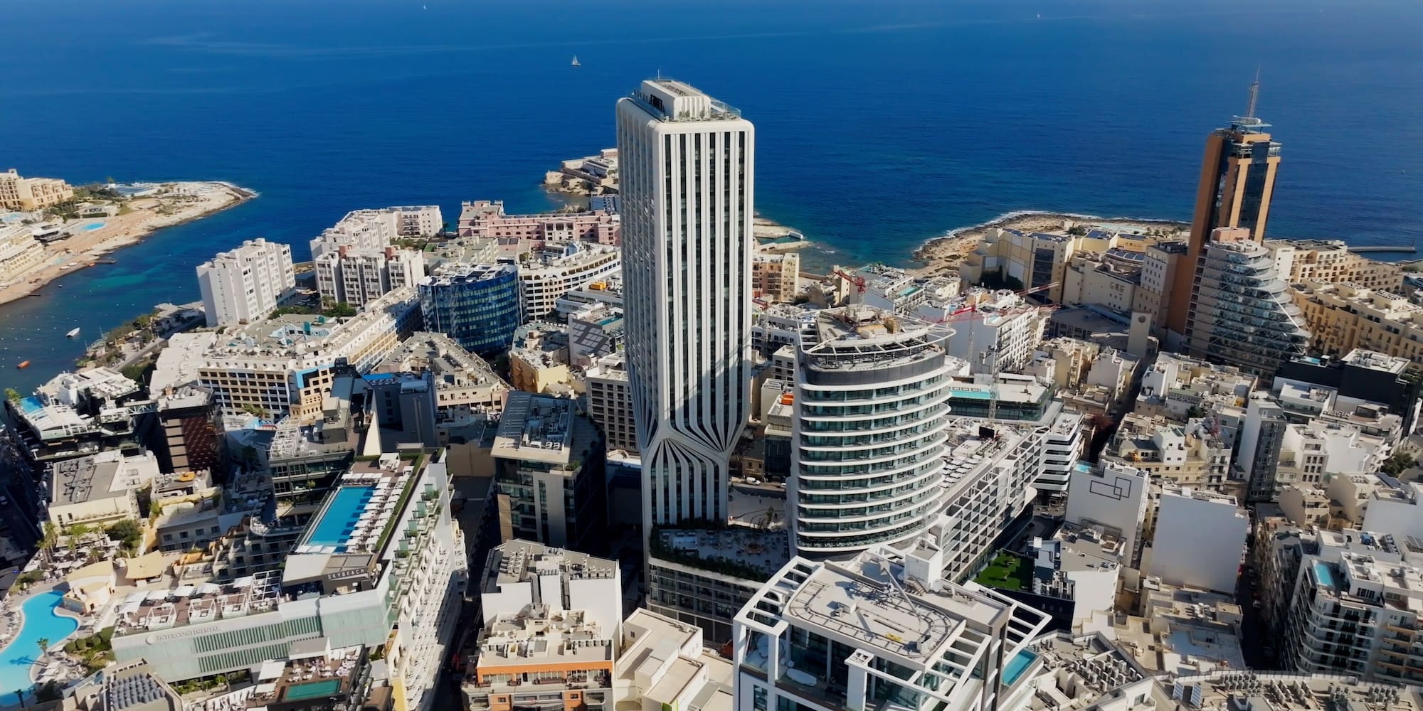 St Julian's, Malta cityscape: Mercury Towers, high-rises by Mediterranean Sea.