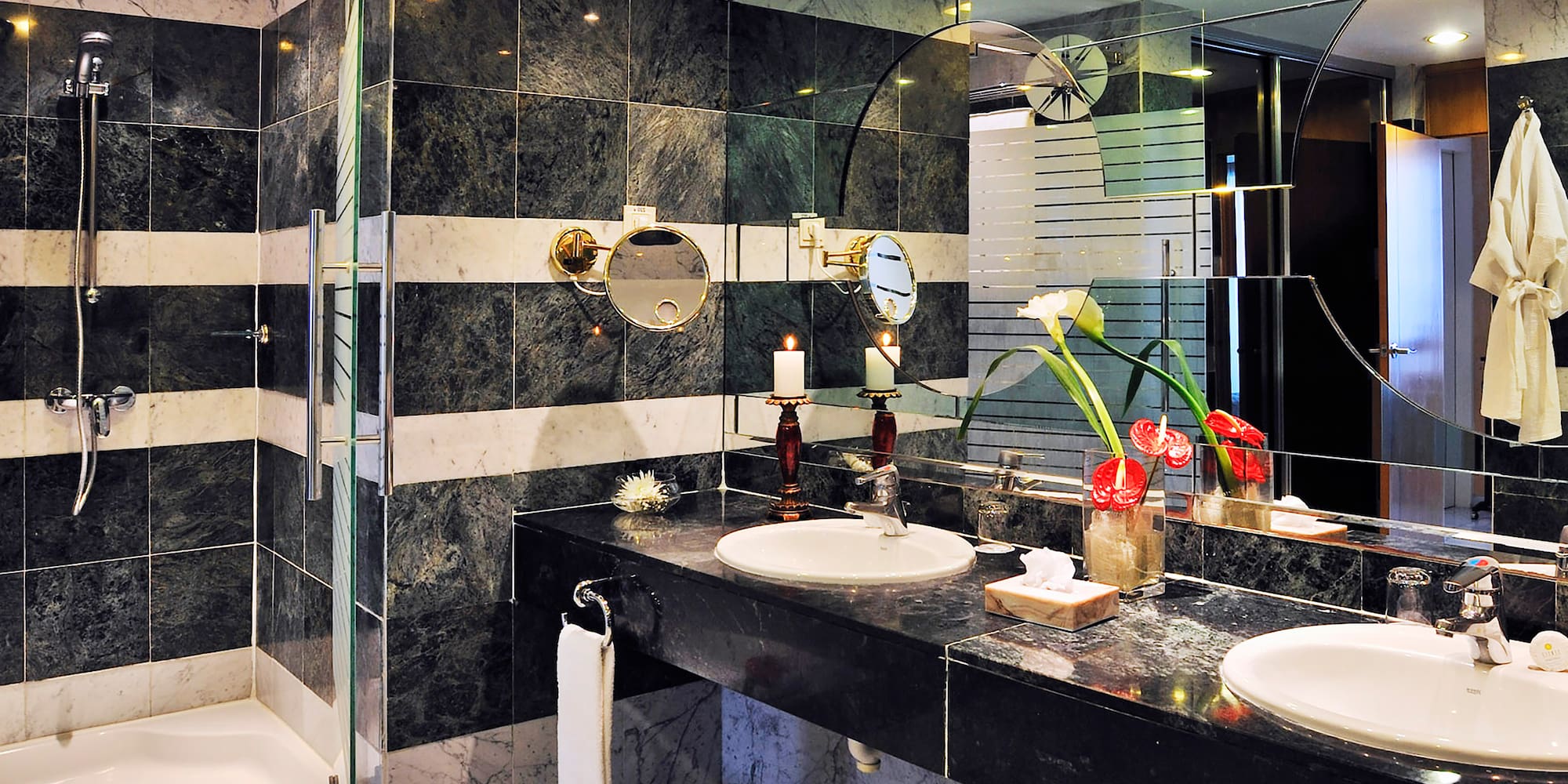 a bathroom with black and white striped walls
