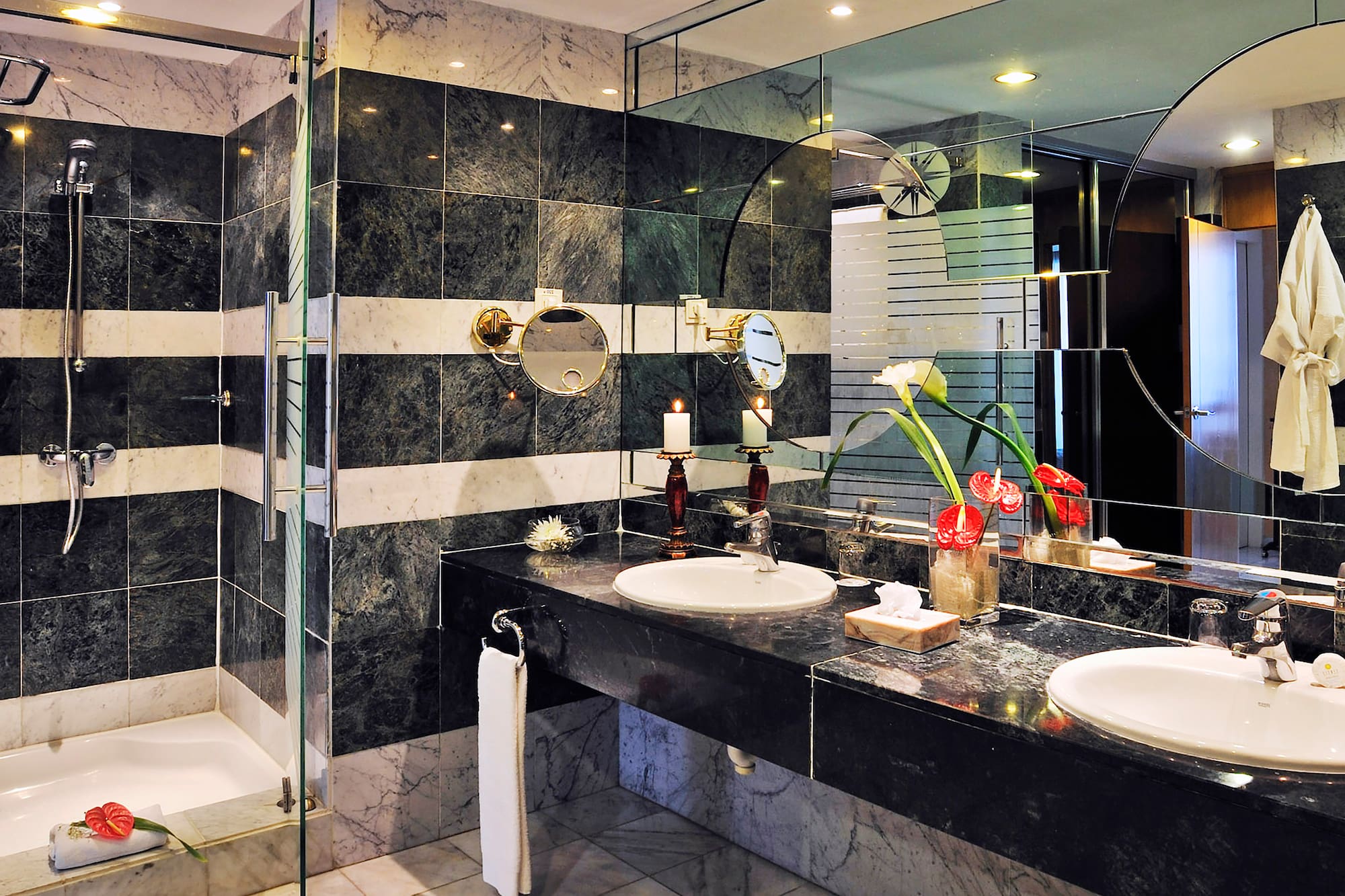 a bathroom with black and white striped walls