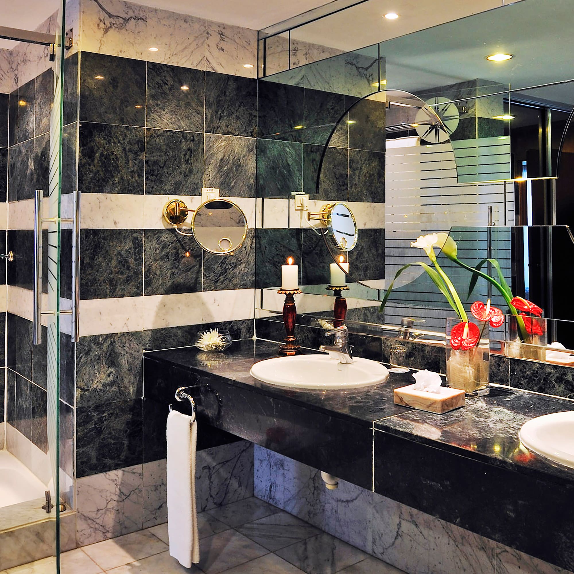a bathroom with black and white striped walls