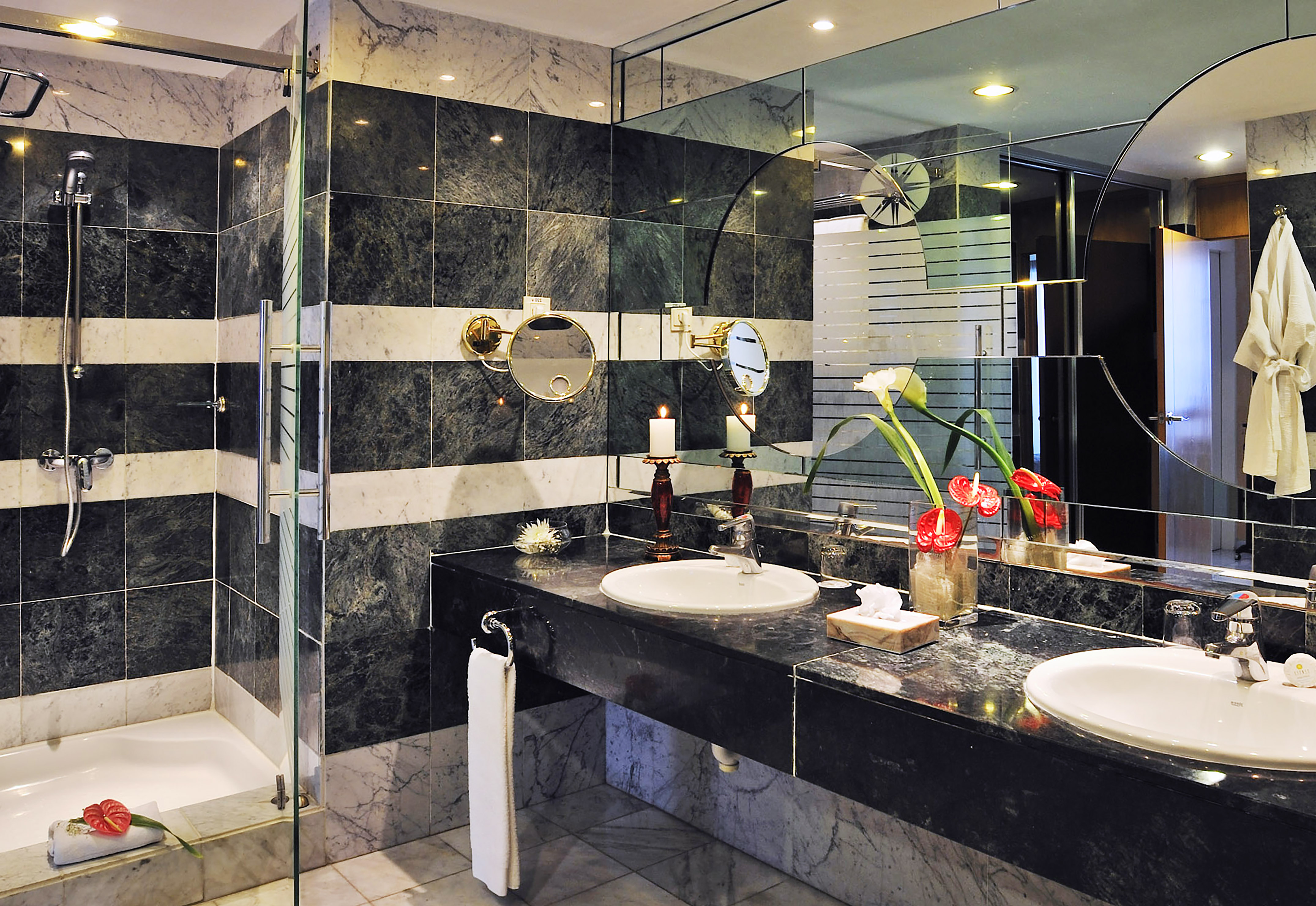 a bathroom with black and white striped walls