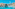 Sailboat in clear turquoise water by rocky cliffs and natural arch.