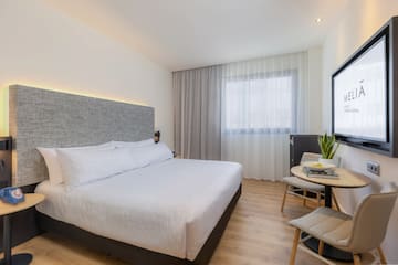 a bedroom with a bed and a table