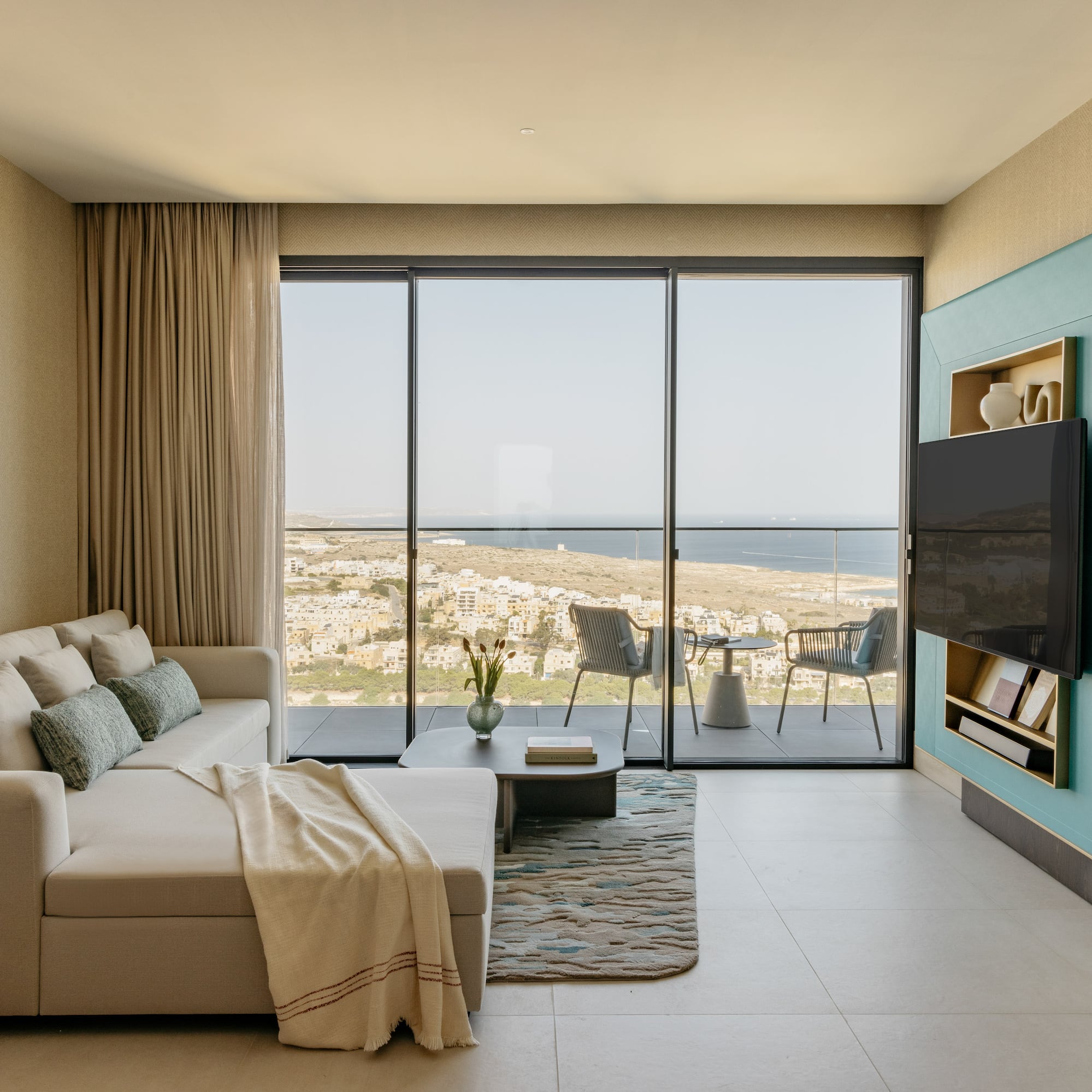 a living room with a large glass door