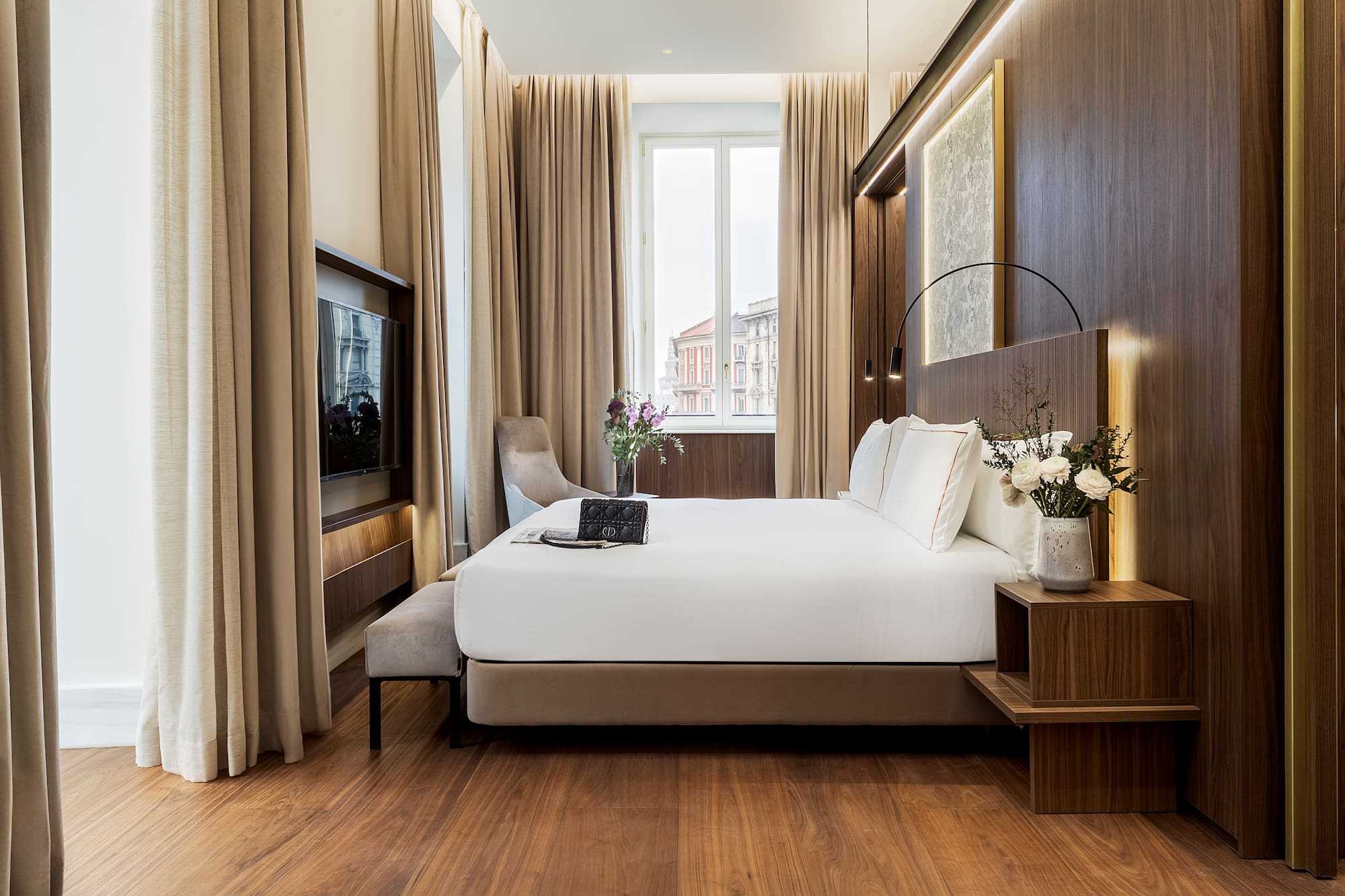 a room with a bed and a television