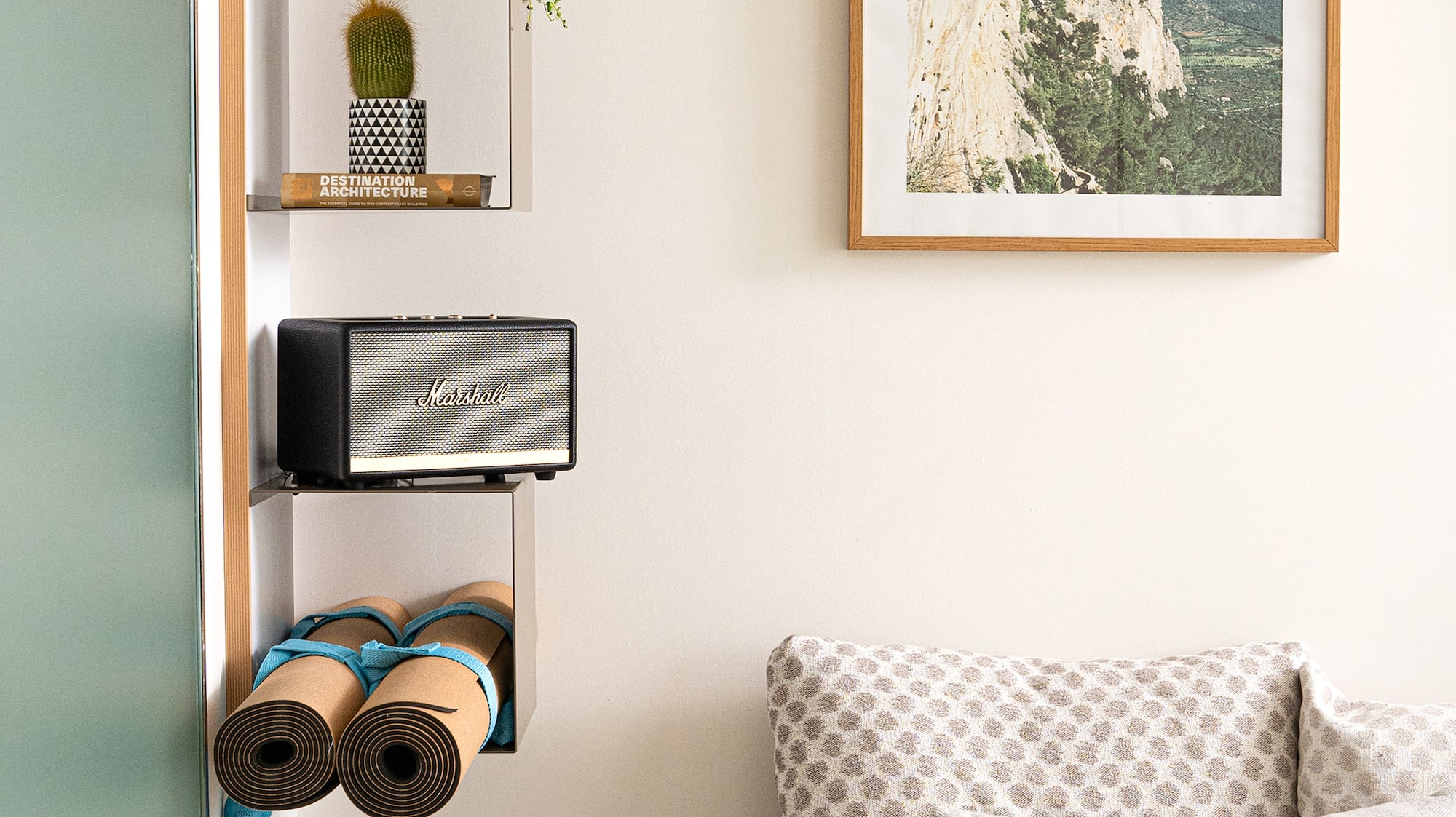 a room with a couch and a picture on the wall
