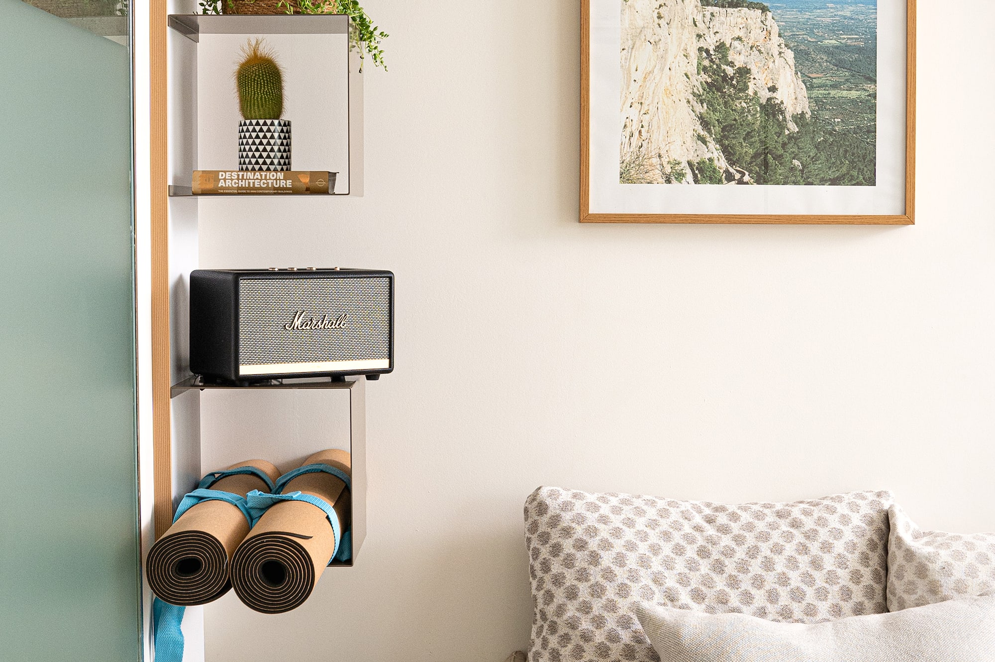 a room with a couch and a picture on the wall