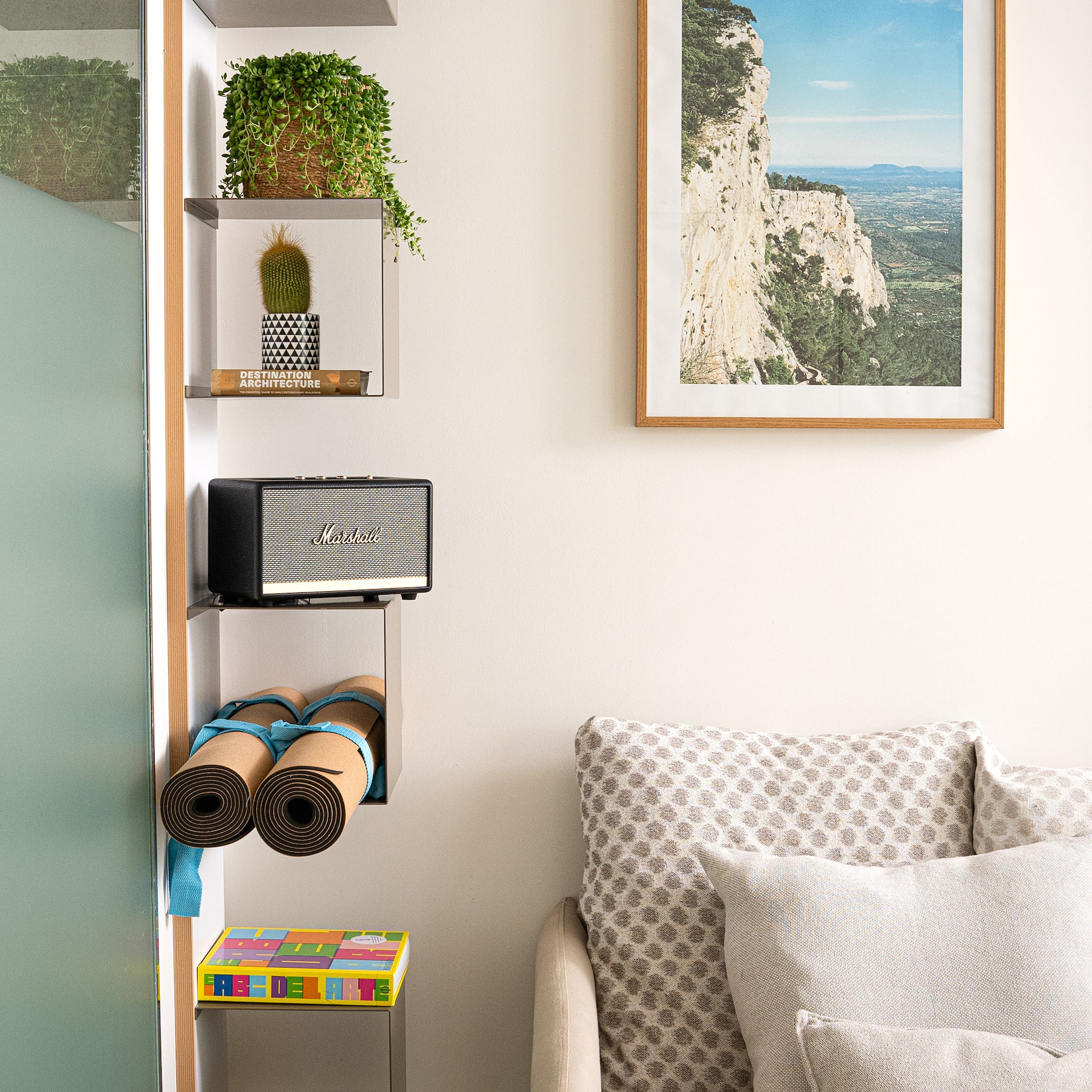 a room with a couch and a picture on the wall