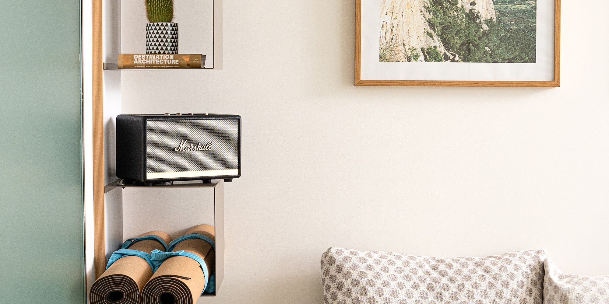 a room with a couch and a picture on the wall