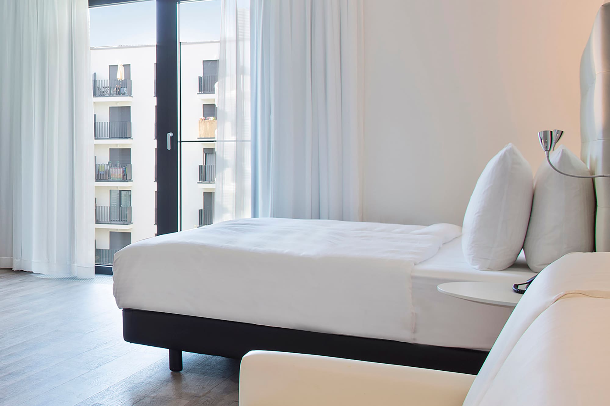 a bedroom with a bed and a couch