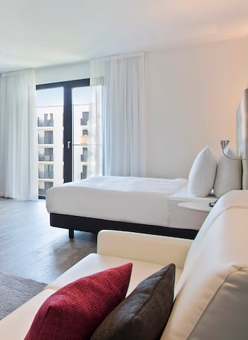 a bedroom with a bed and a couch