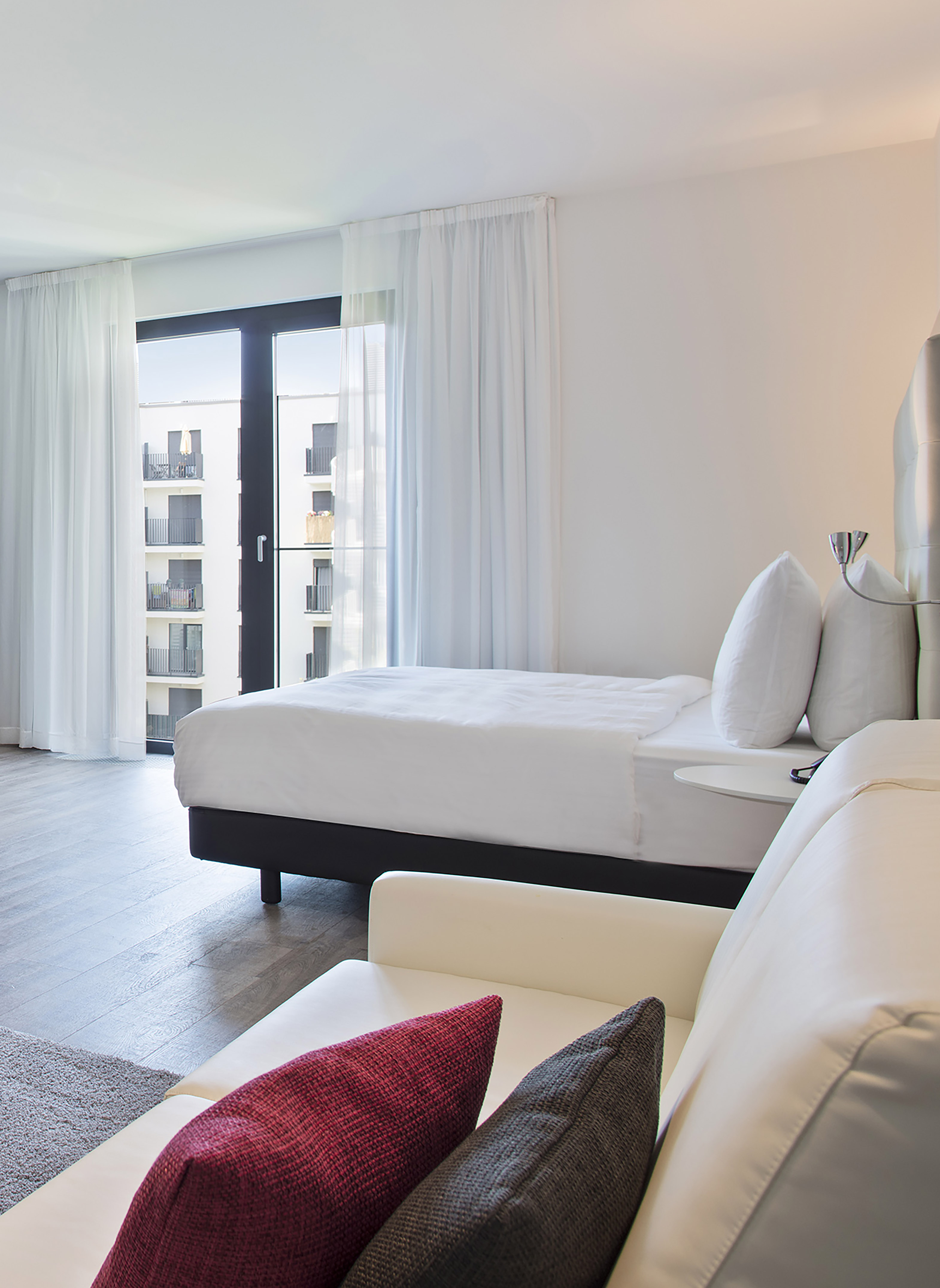 a bedroom with a bed and a couch