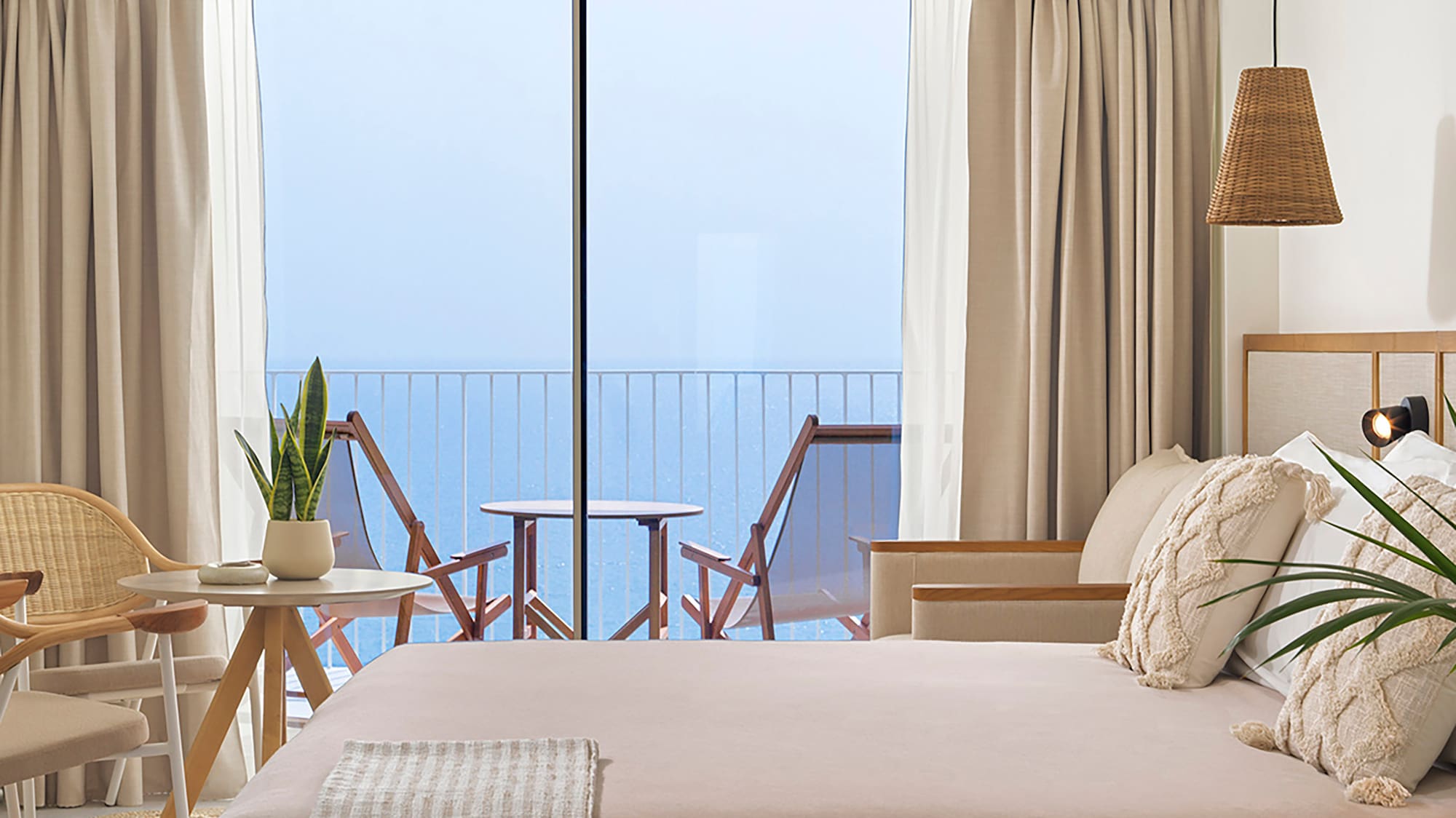 a bedroom with a large bed and a ceiling fan