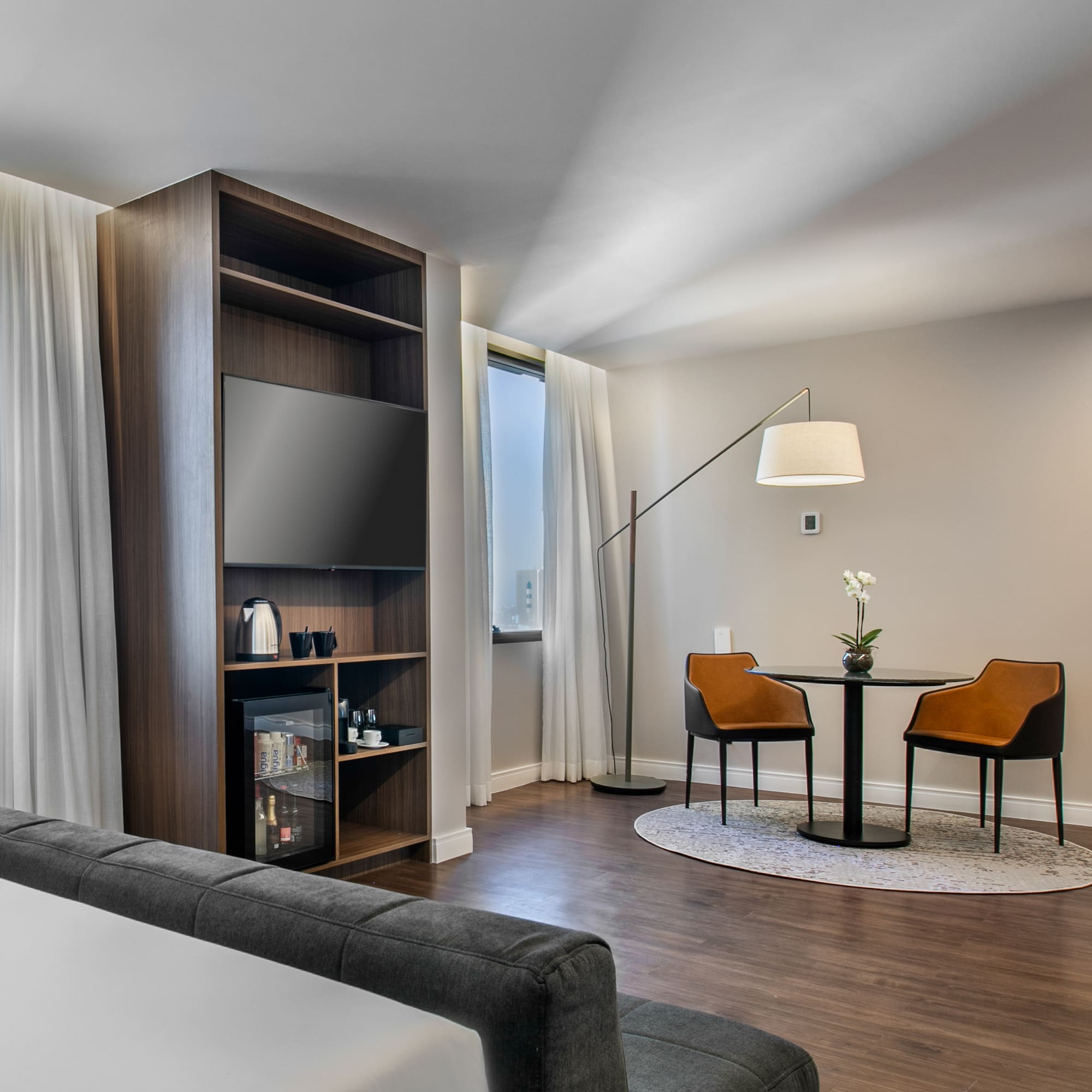 a room with a tv and a table