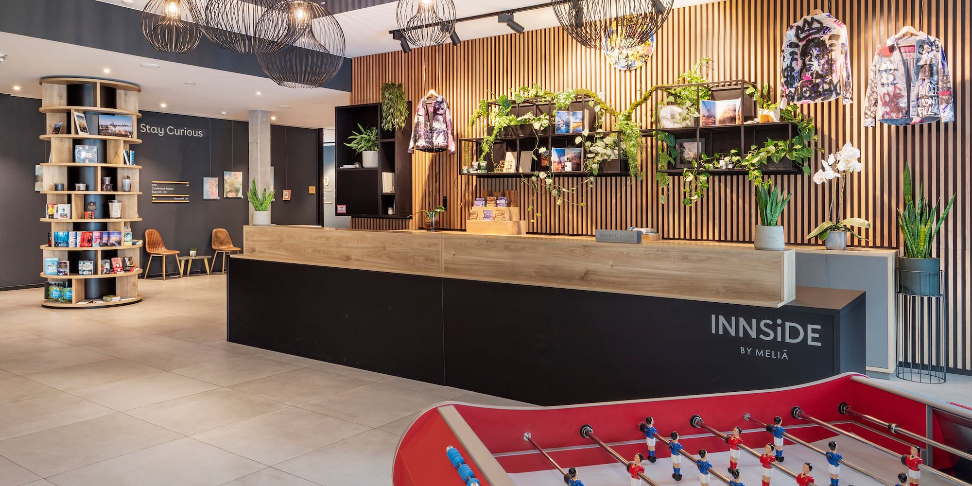 a room with a table and a table with foosballs