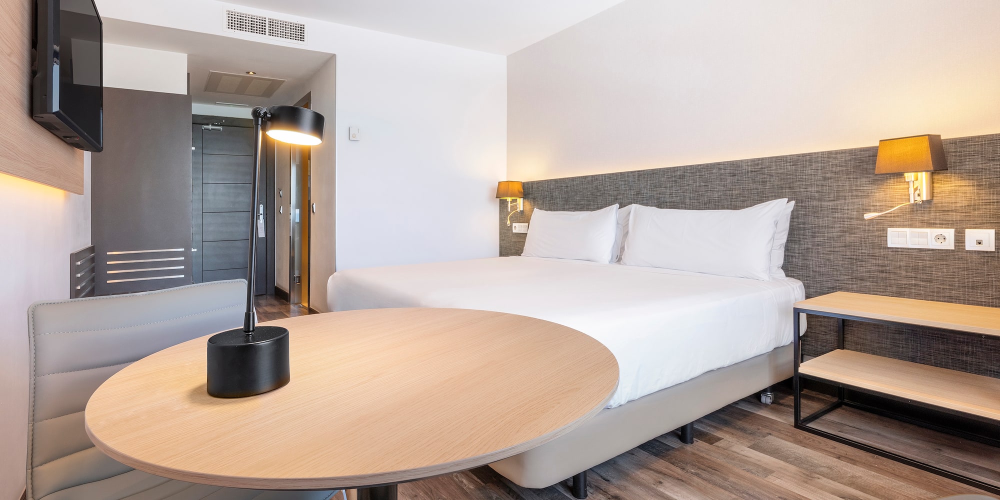 a room with a bed and a table