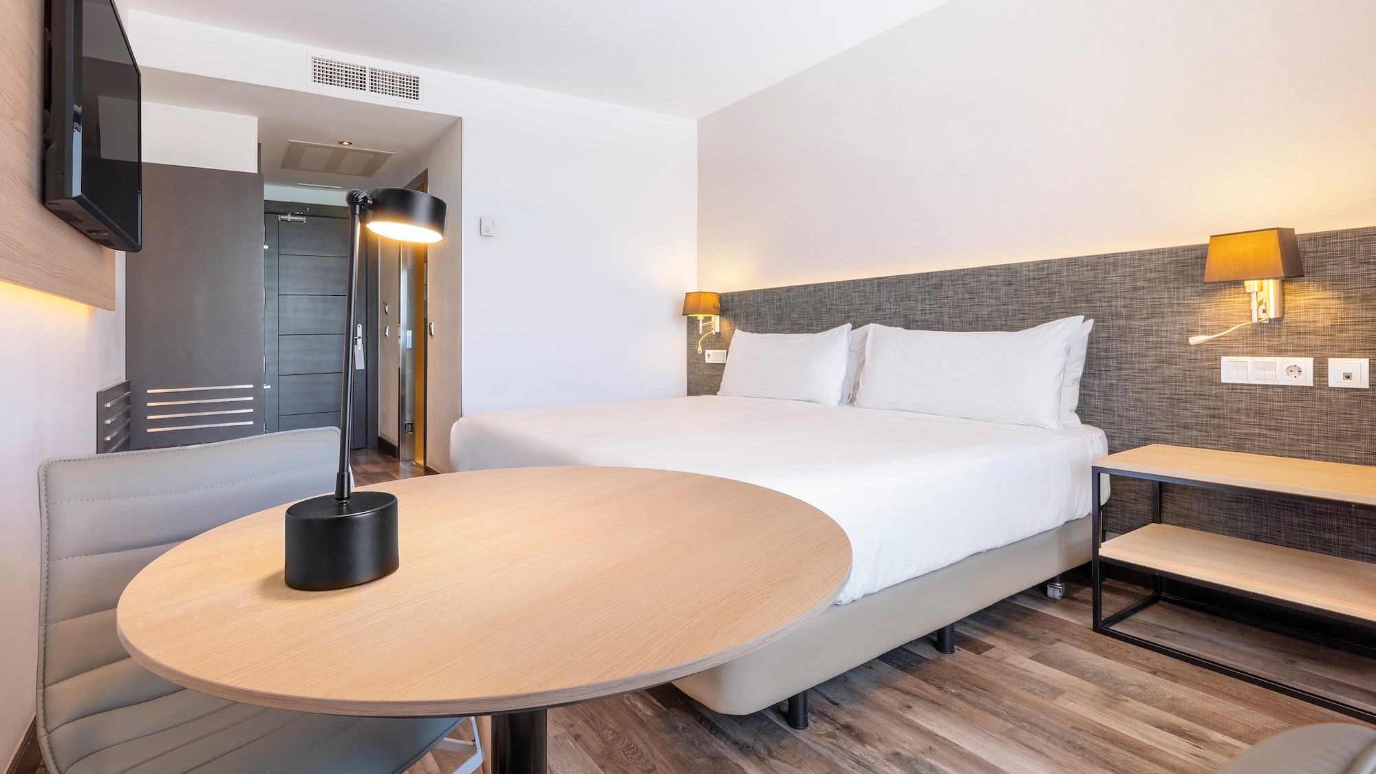 a room with a bed and a table