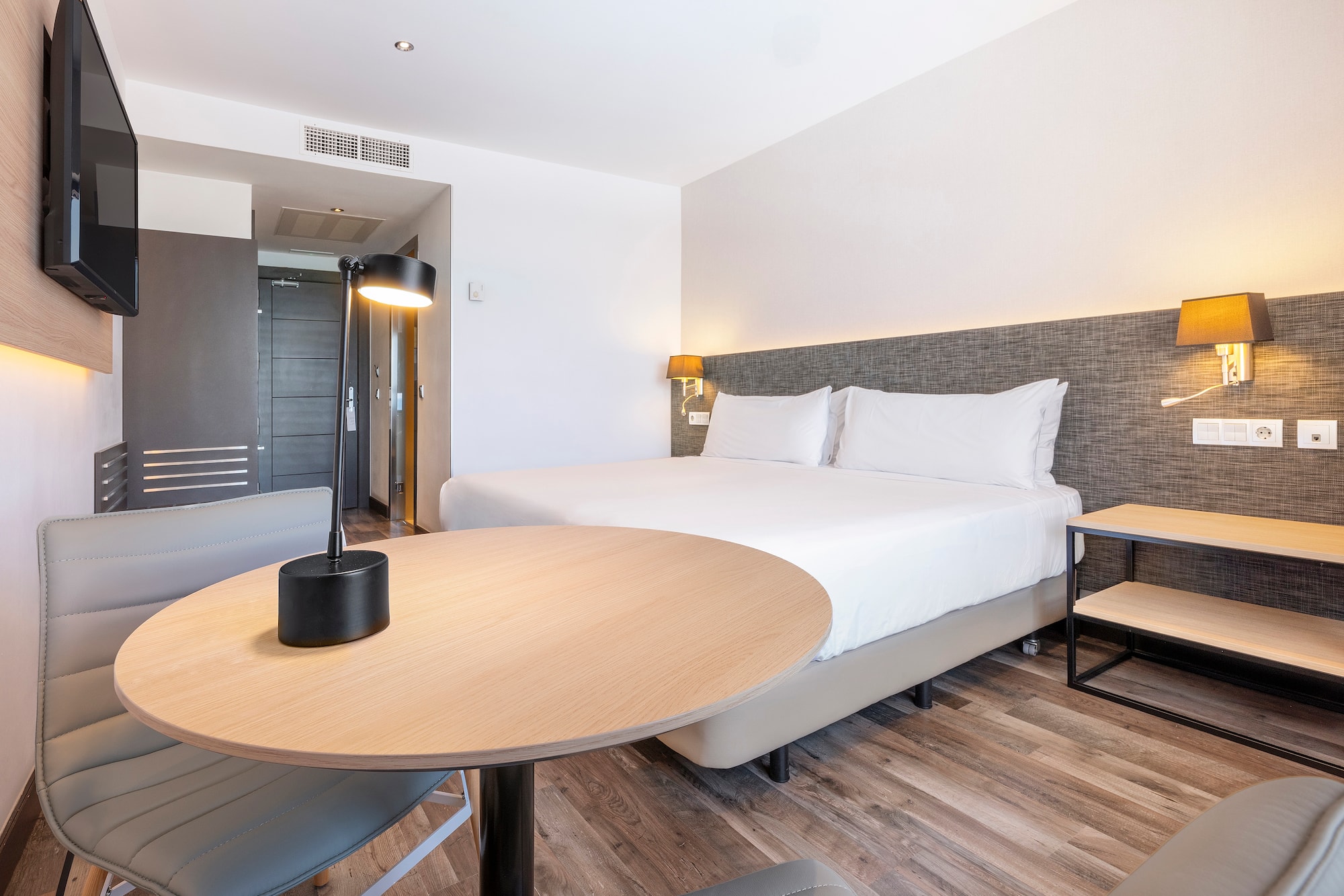 a room with a bed and a table