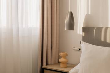 a bed with a lamp and a table