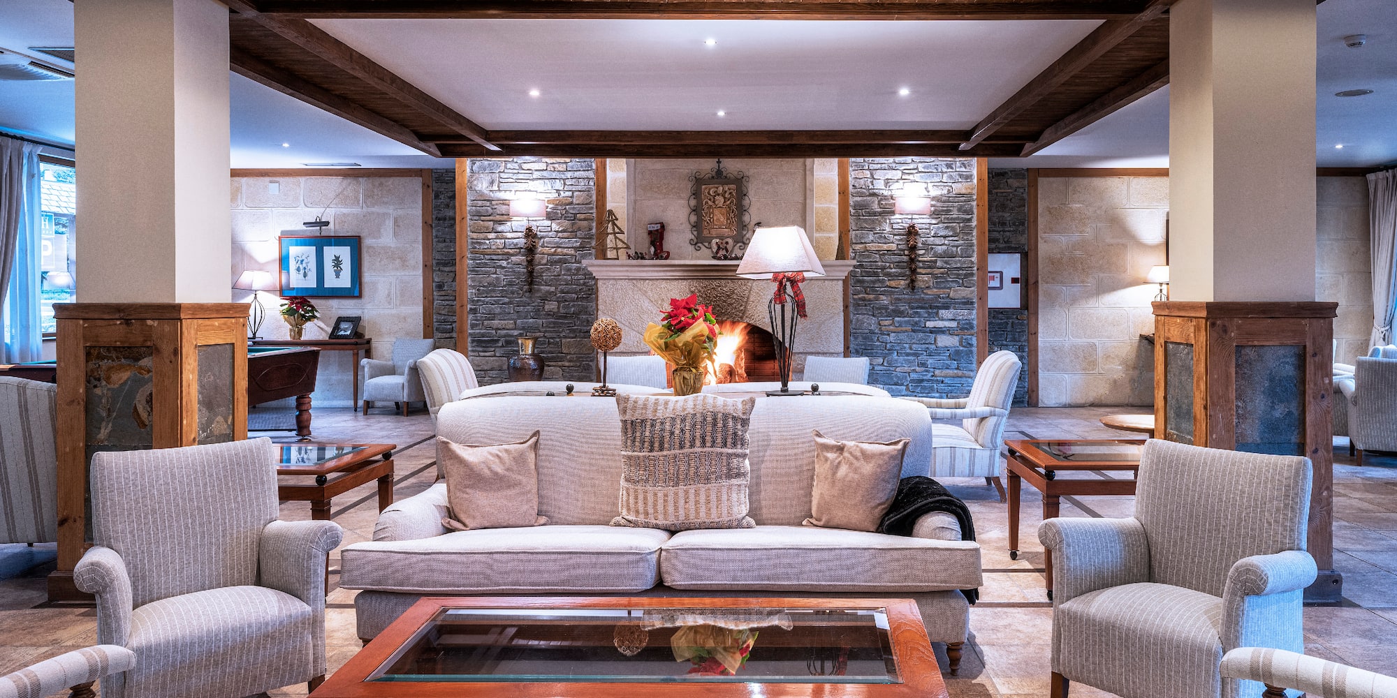 a living room with a fireplace and couches