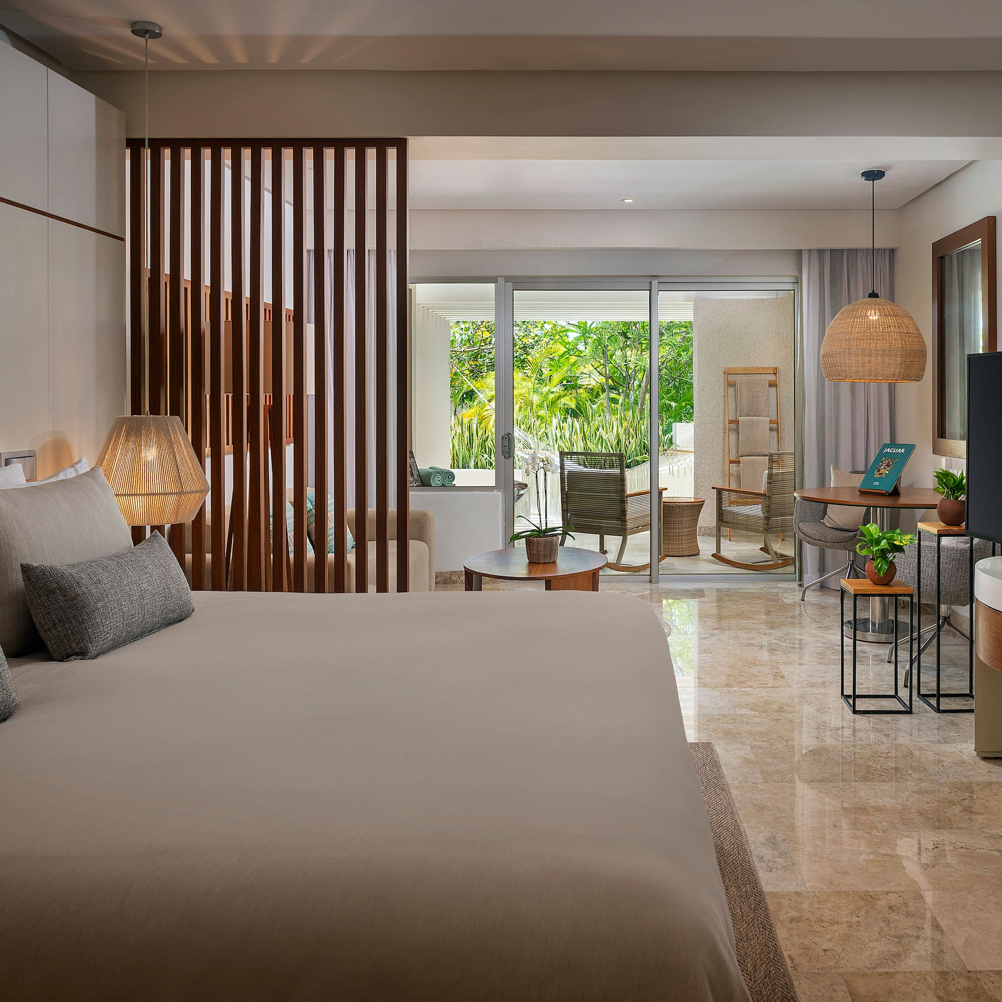 a bedroom with a television and a large bed