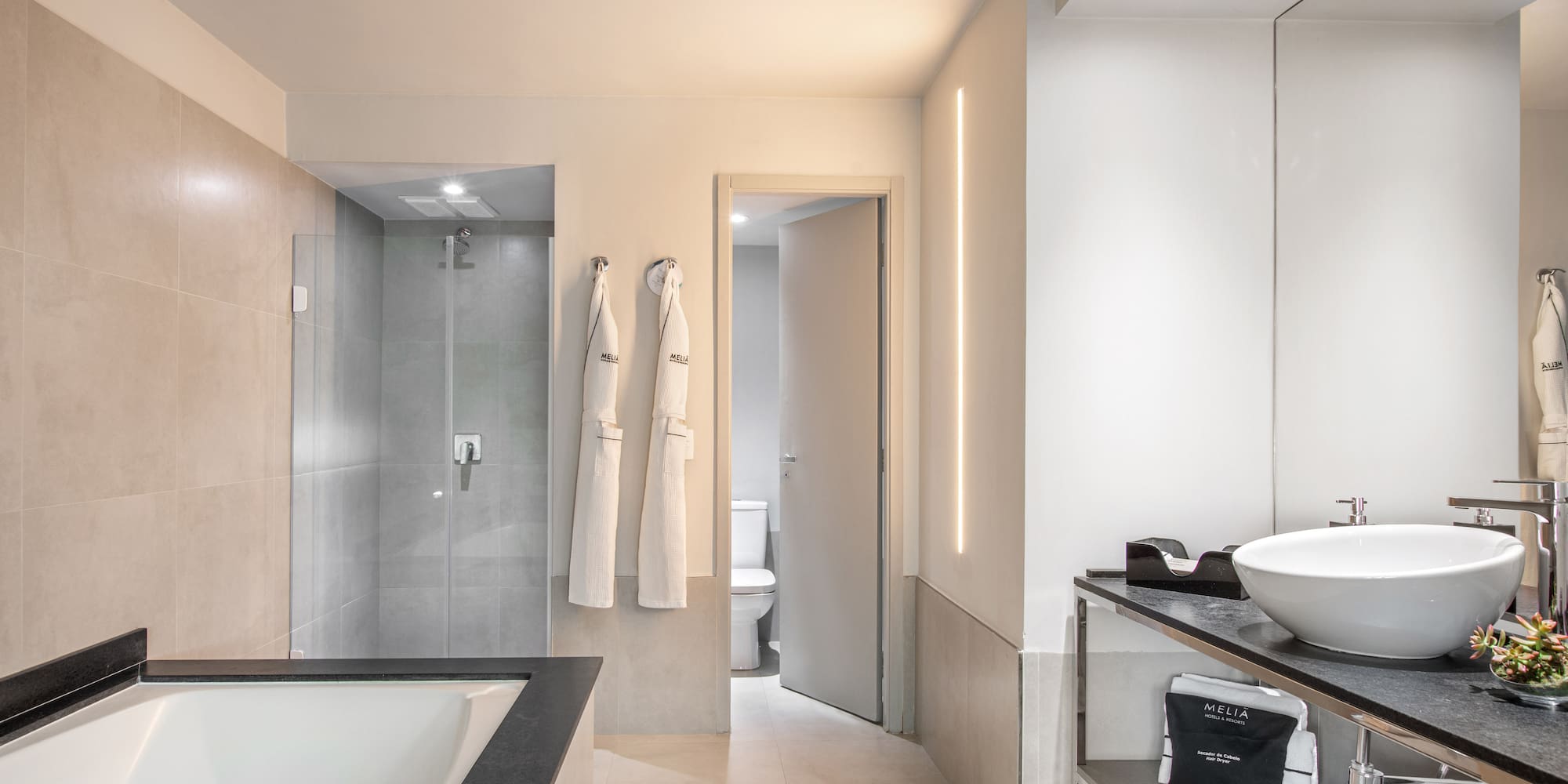 a bathroom with a bathtub and shower