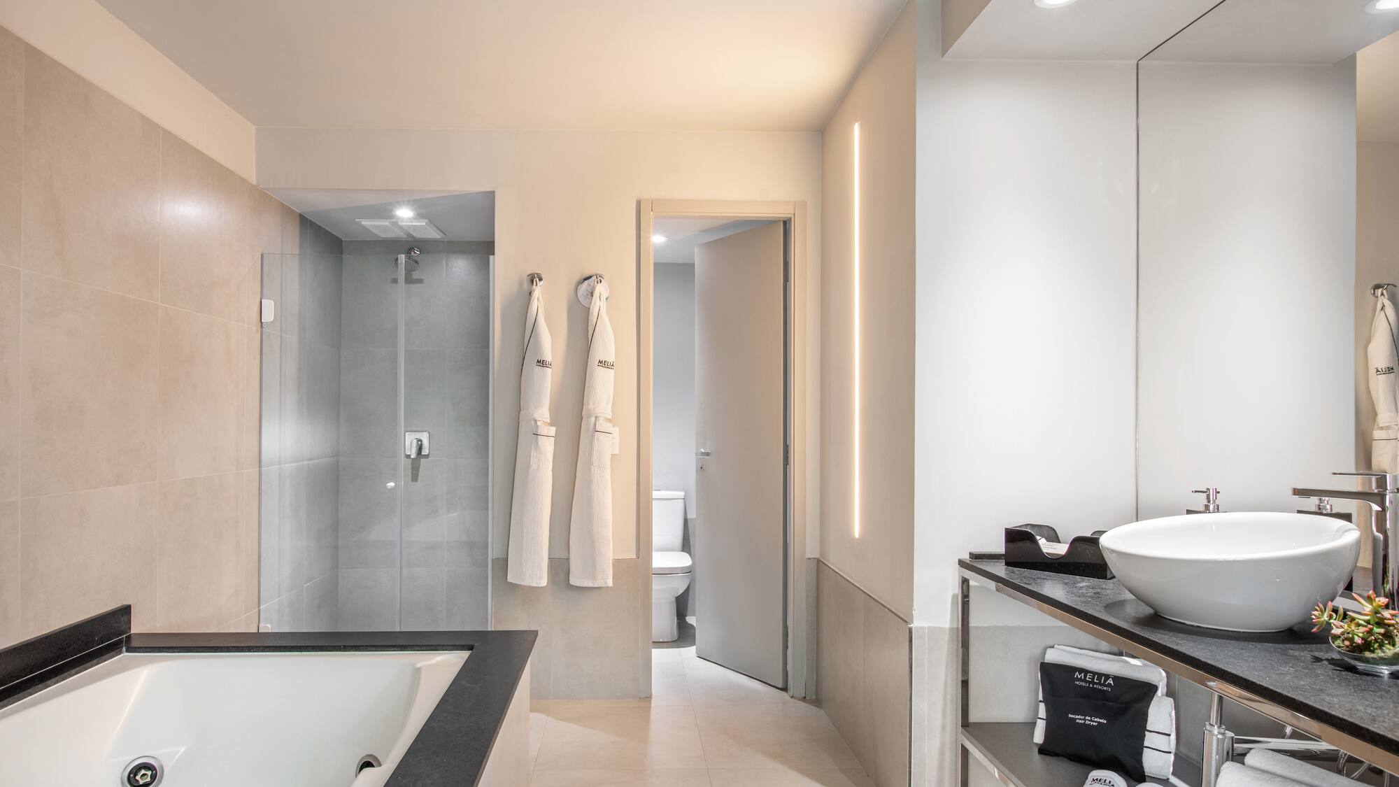 a bathroom with a bathtub and shower