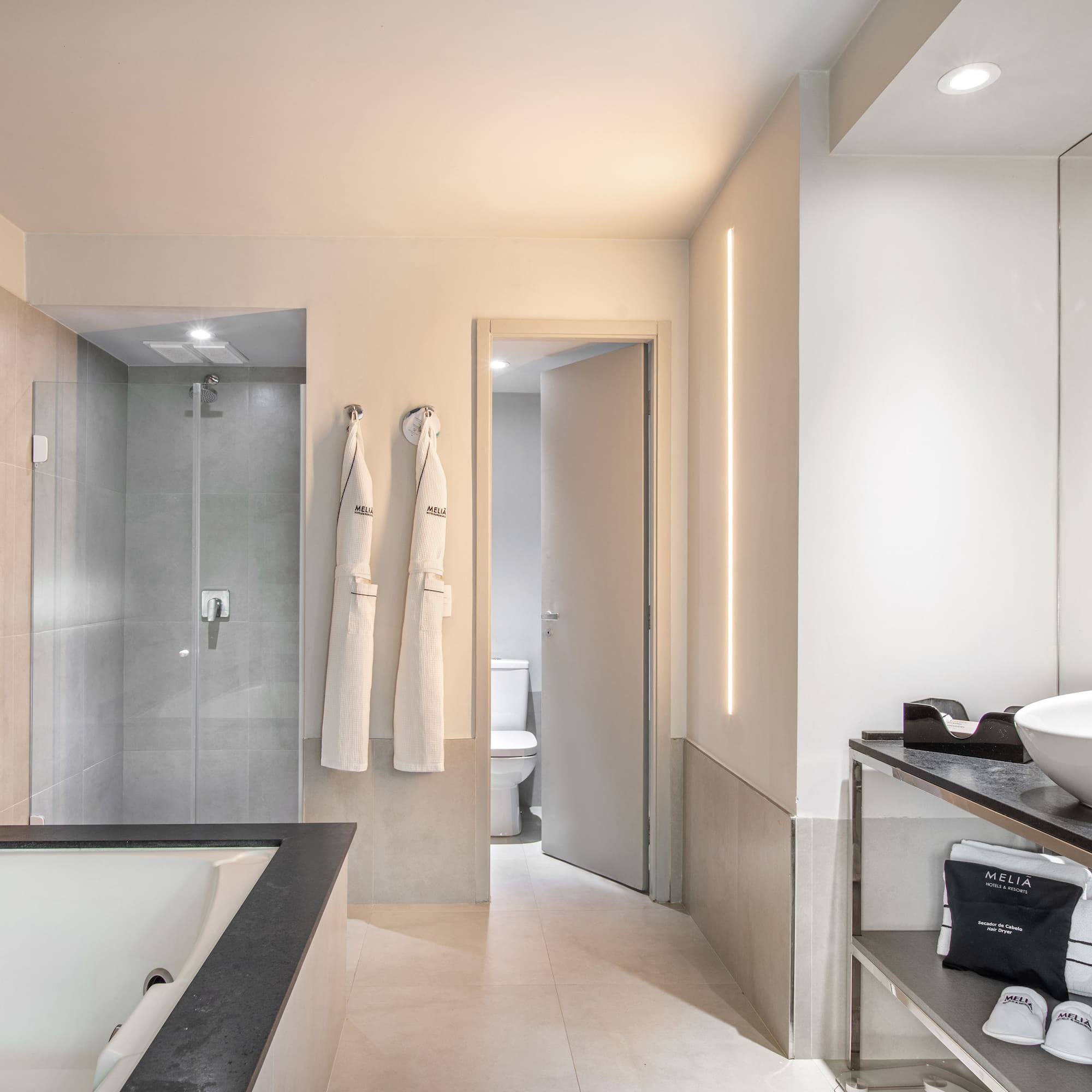 a bathroom with a bathtub and shower