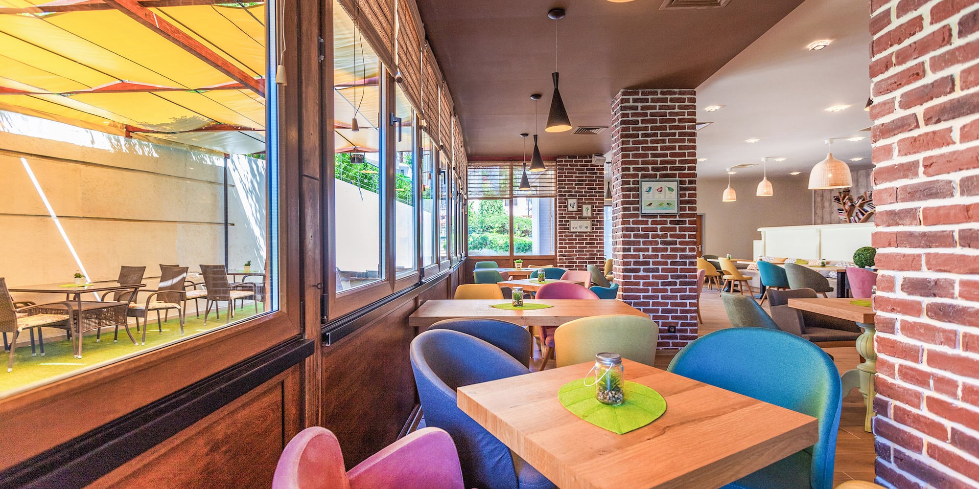 a colorful chairs and tables in a restaurant