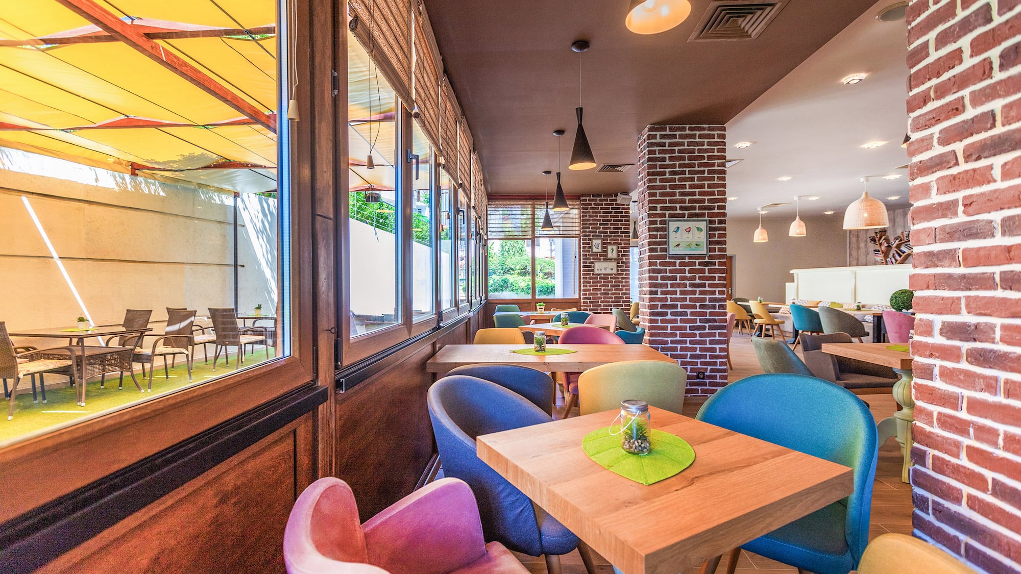 a colorful chairs and tables in a restaurant