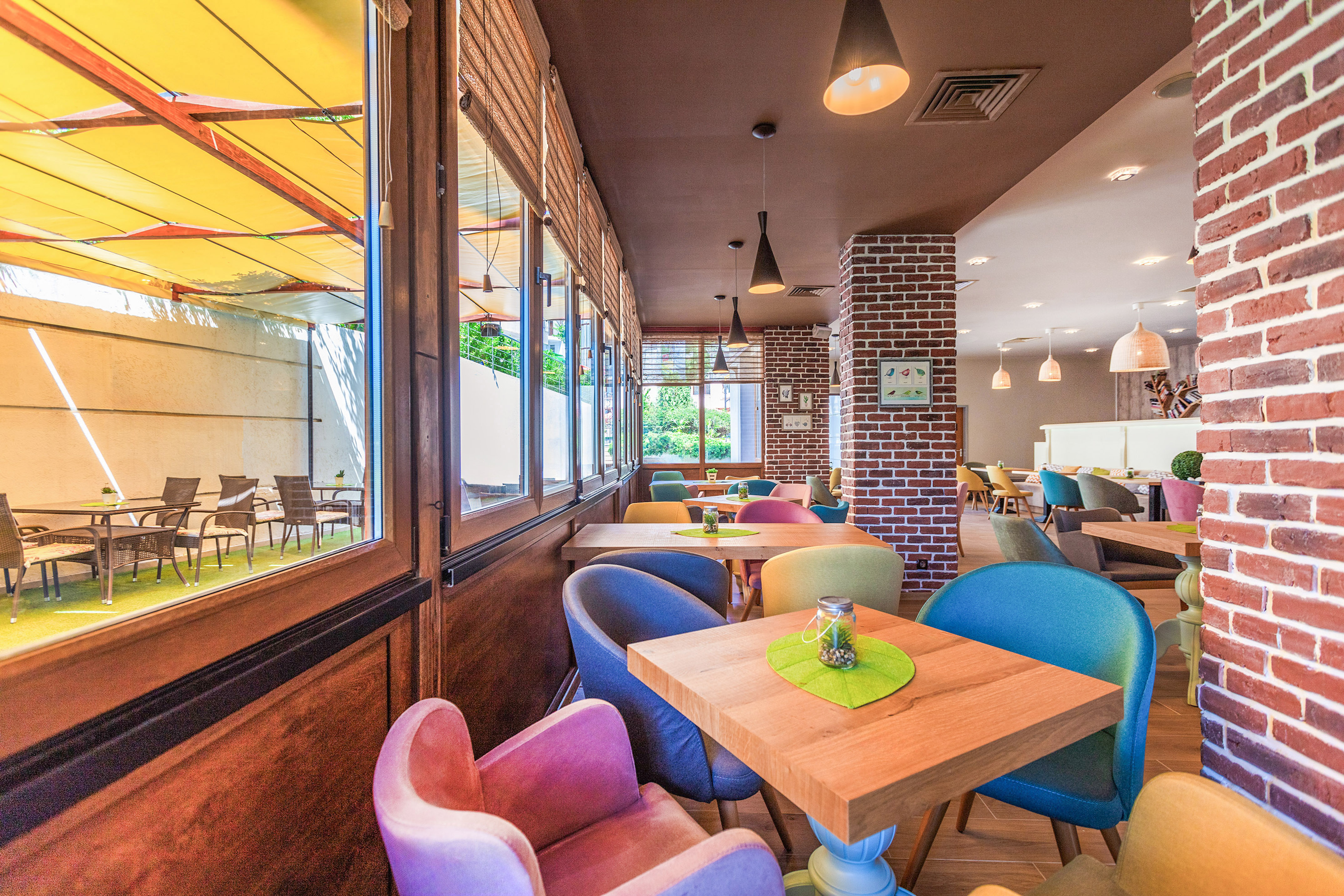a colorful chairs and tables in a restaurant