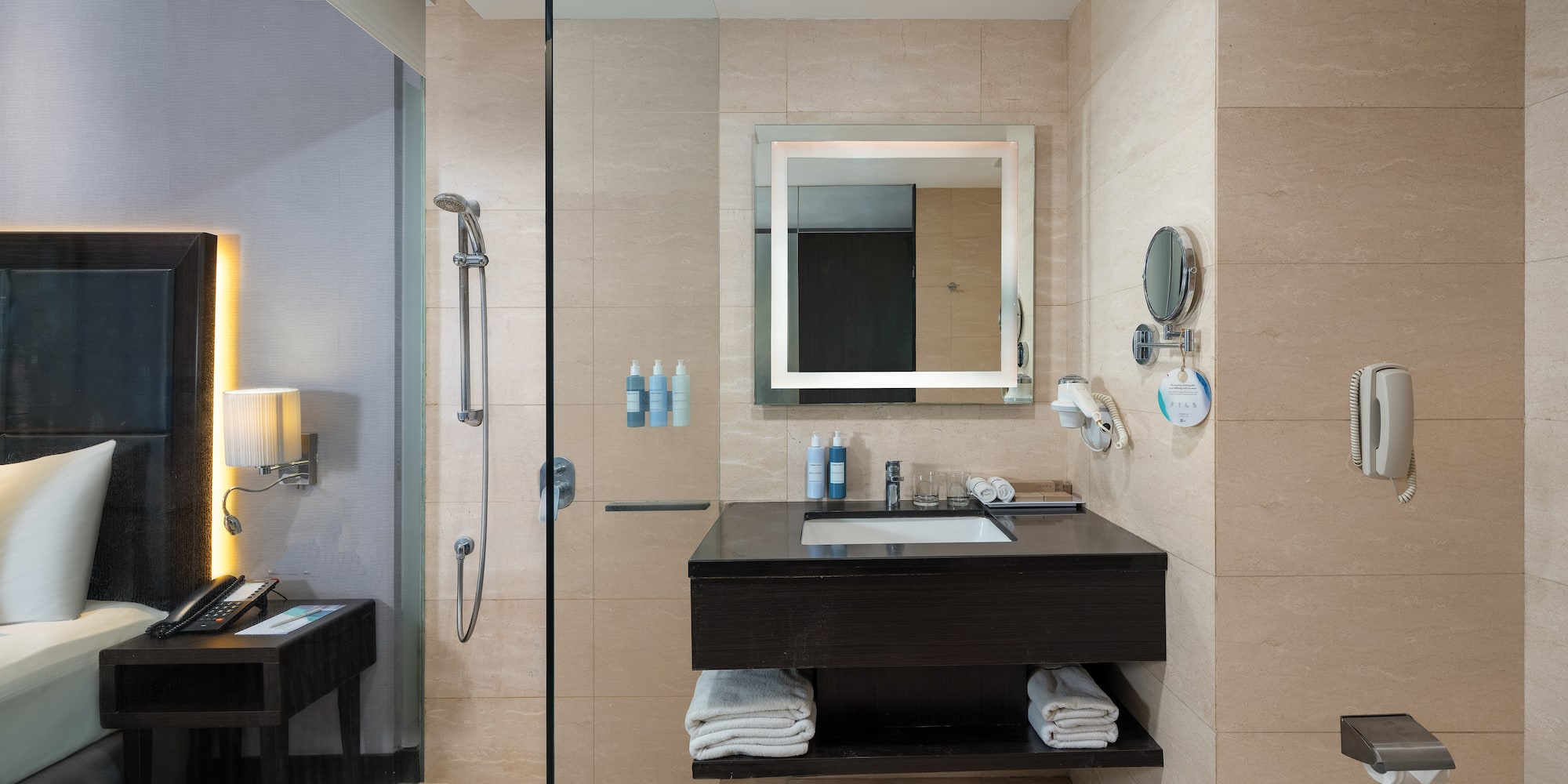 a bathroom with a shower and a sink