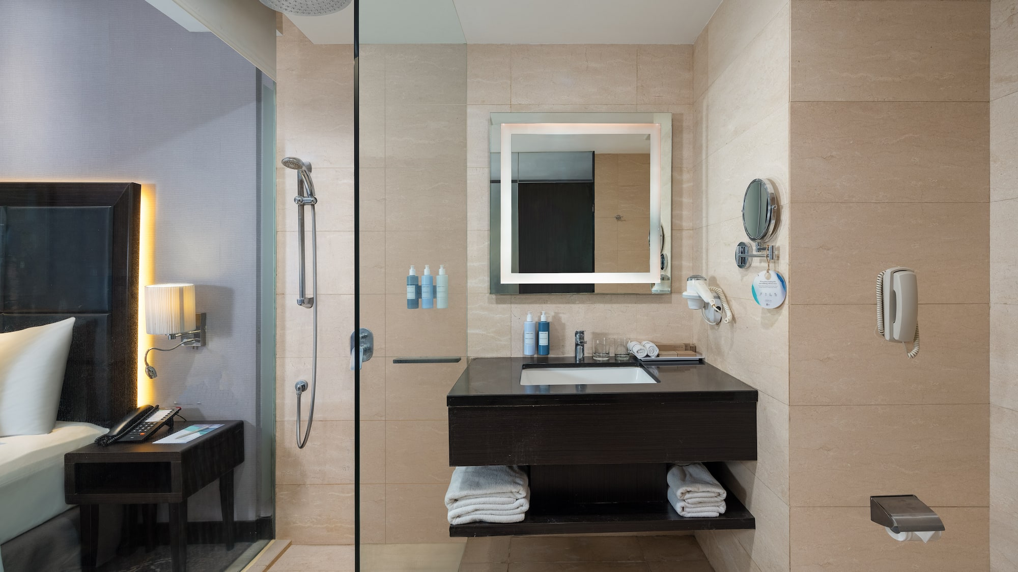 a bathroom with a shower and a sink