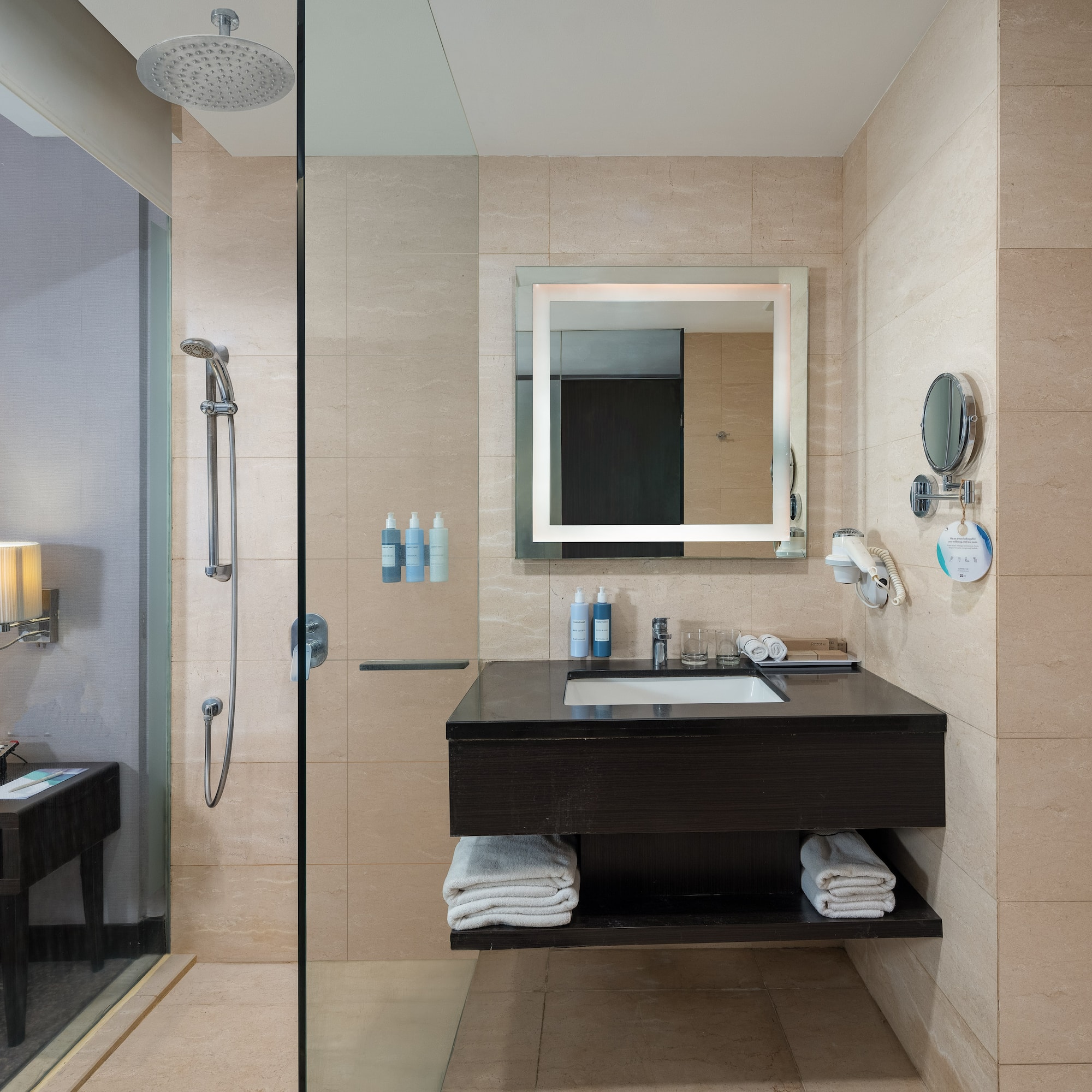 a bathroom with a shower and a sink