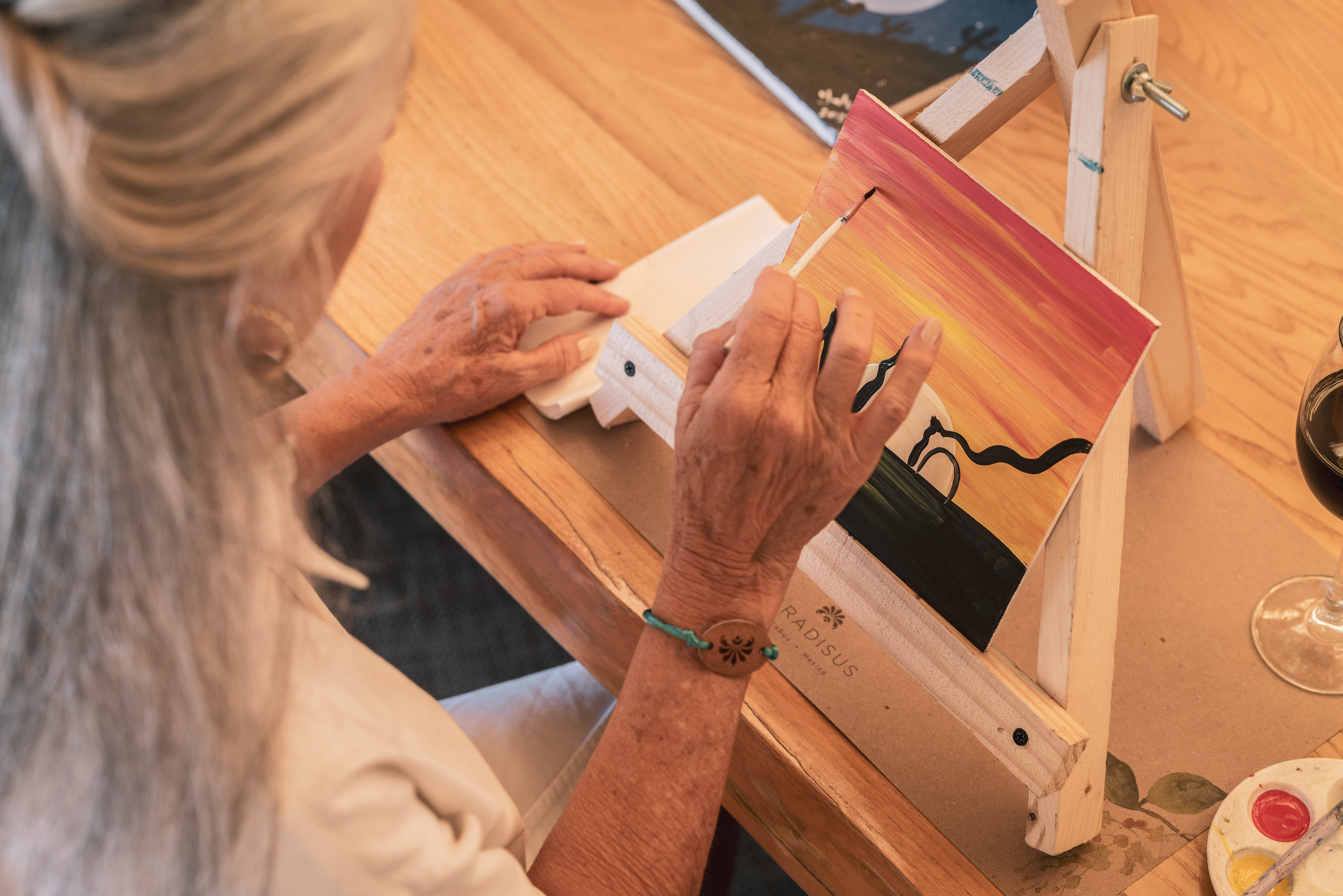 a person painting on a easel