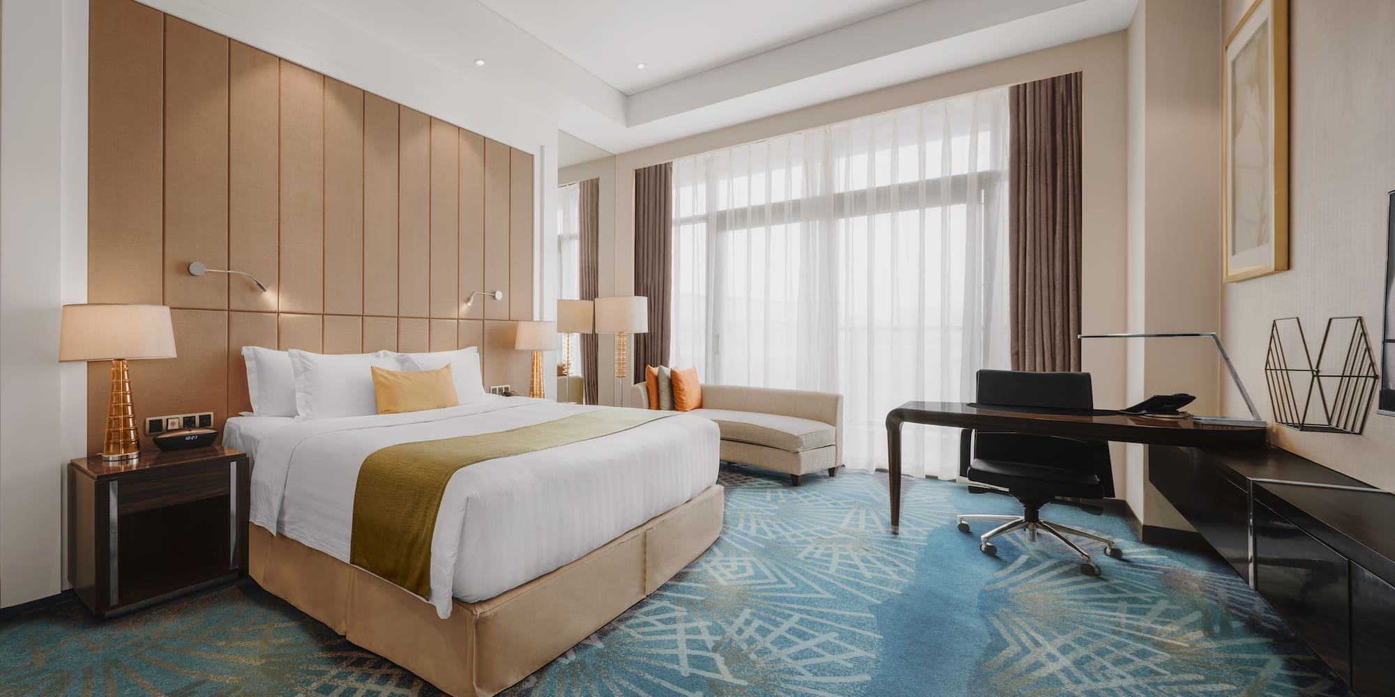 a room with a bed and desk