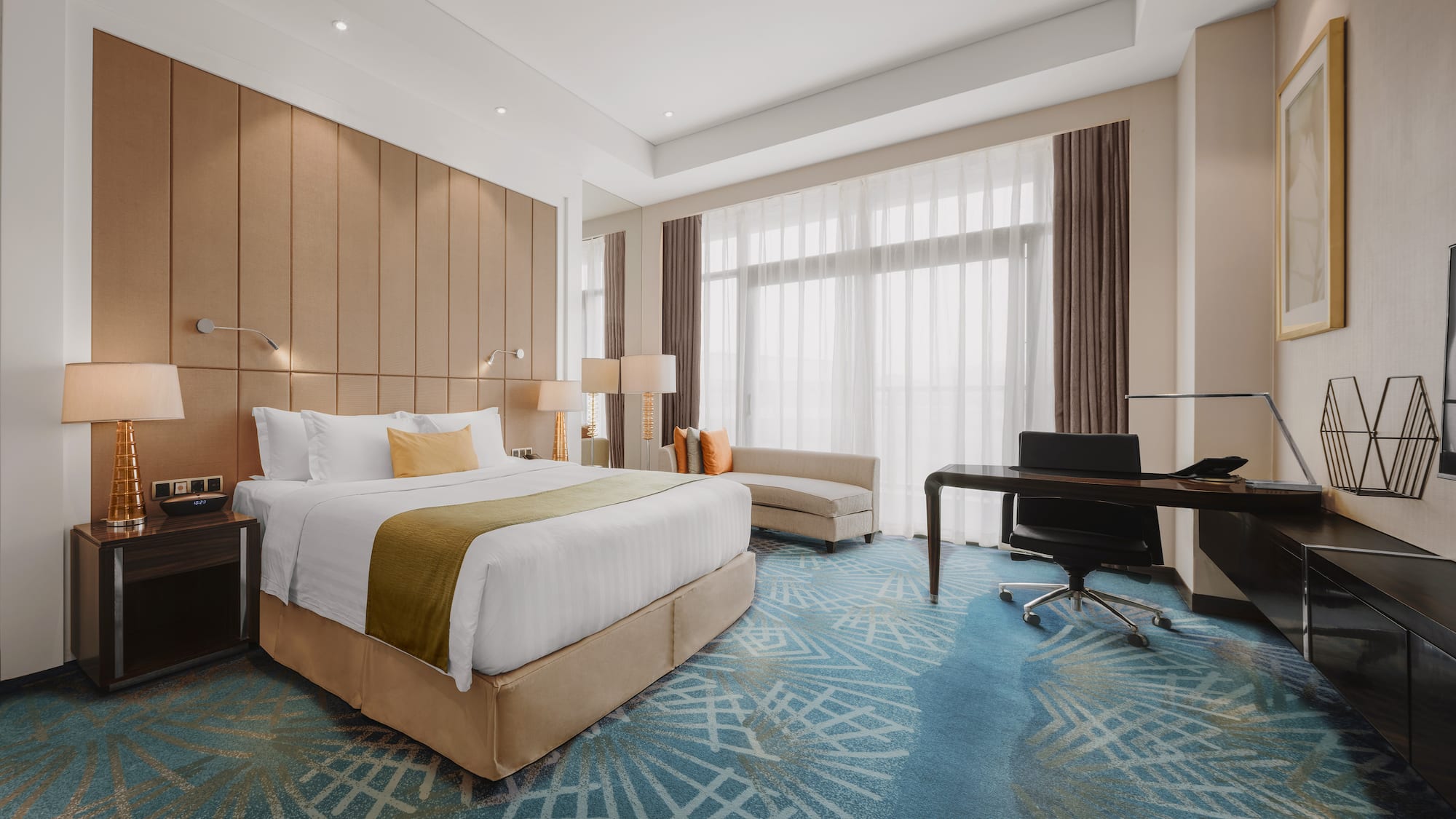 a room with a bed and desk