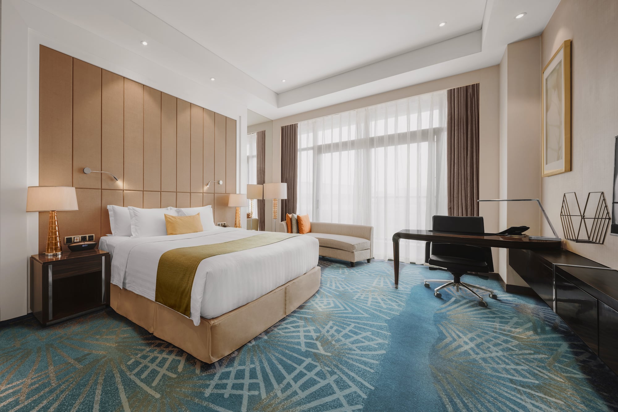 a room with a bed and desk