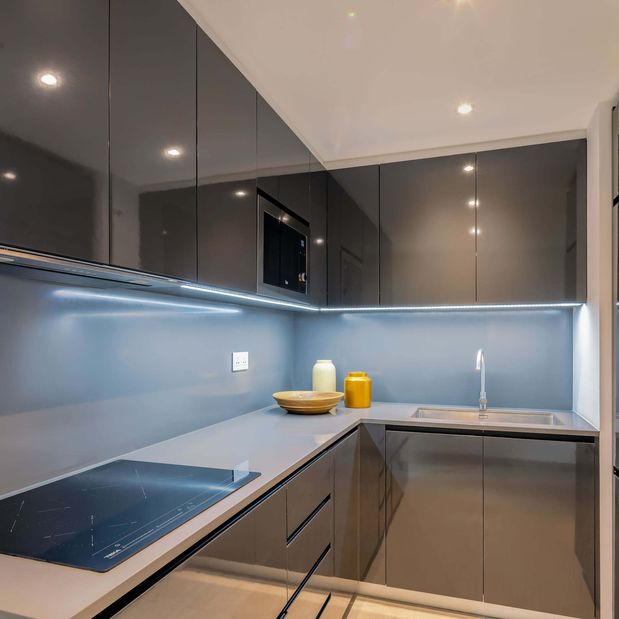 a kitchen with a sink and a microwave