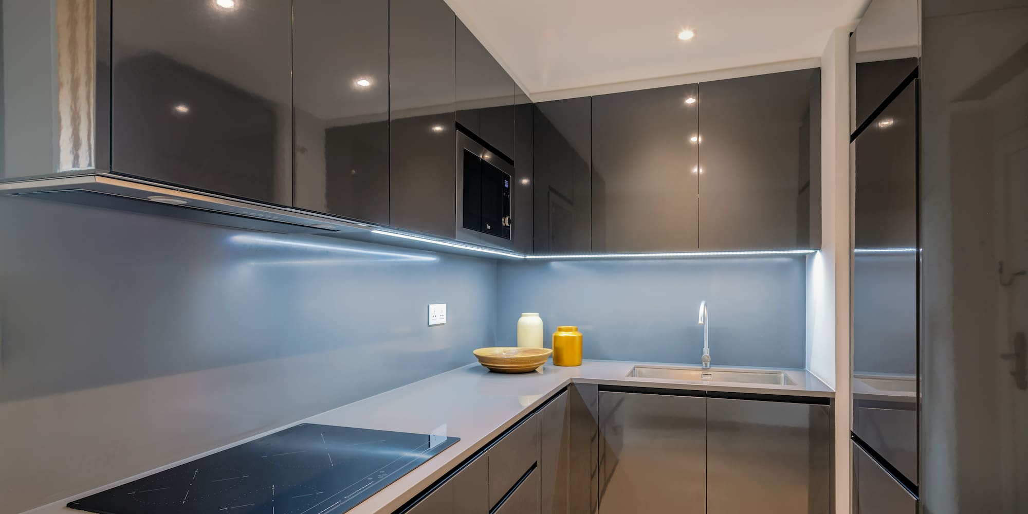 a kitchen with a sink and a microwave