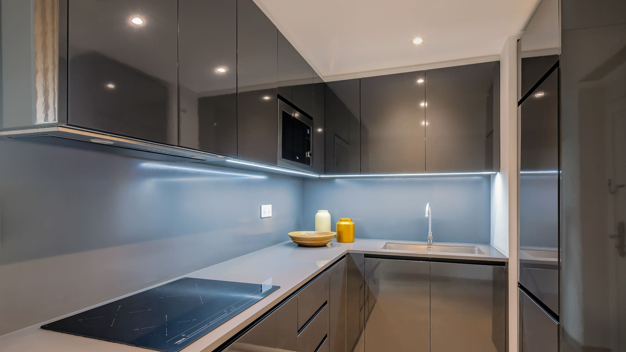 a kitchen with a sink and a microwave