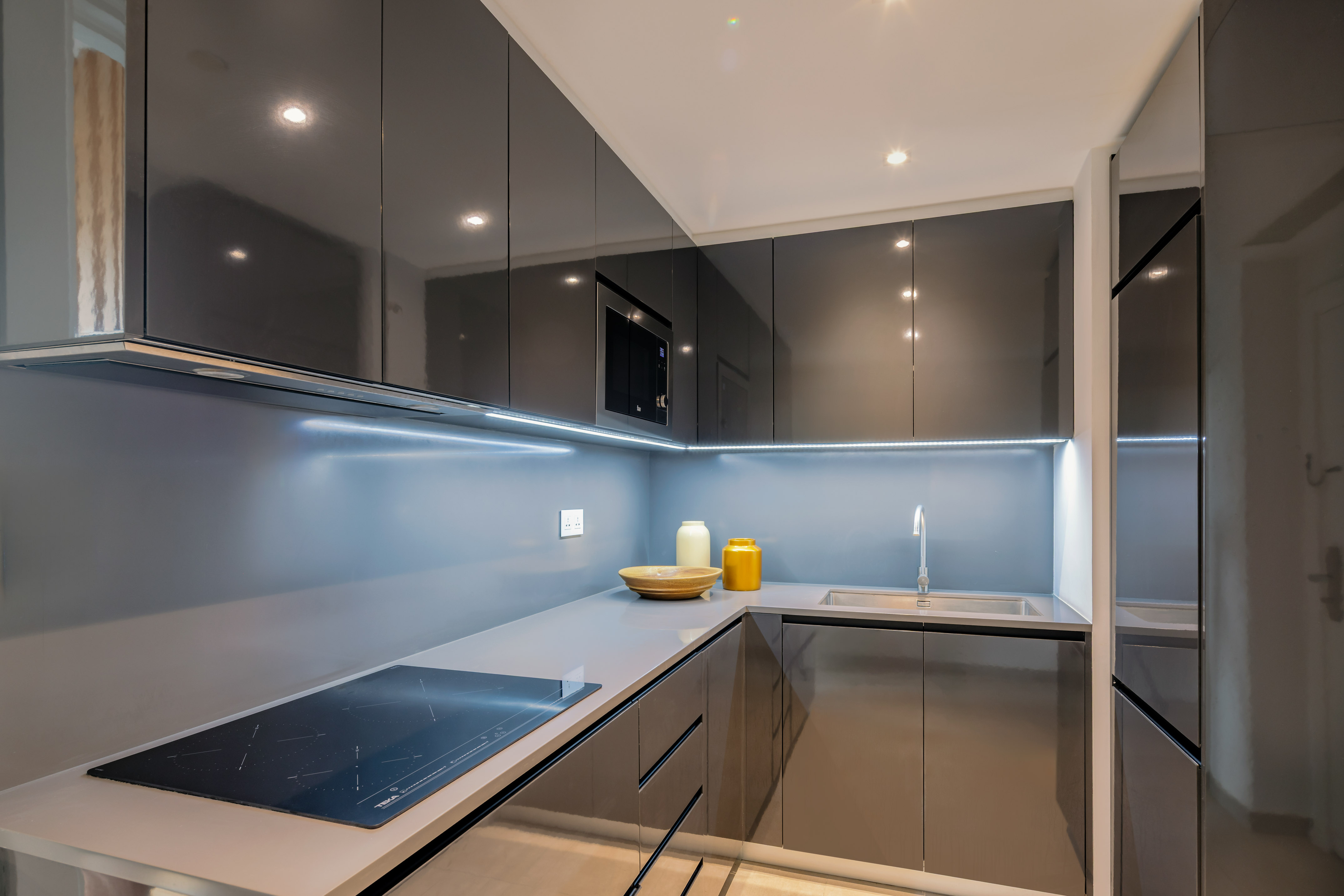 a kitchen with a sink and a microwave