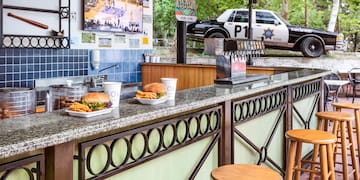 a counter with food and drinks on it