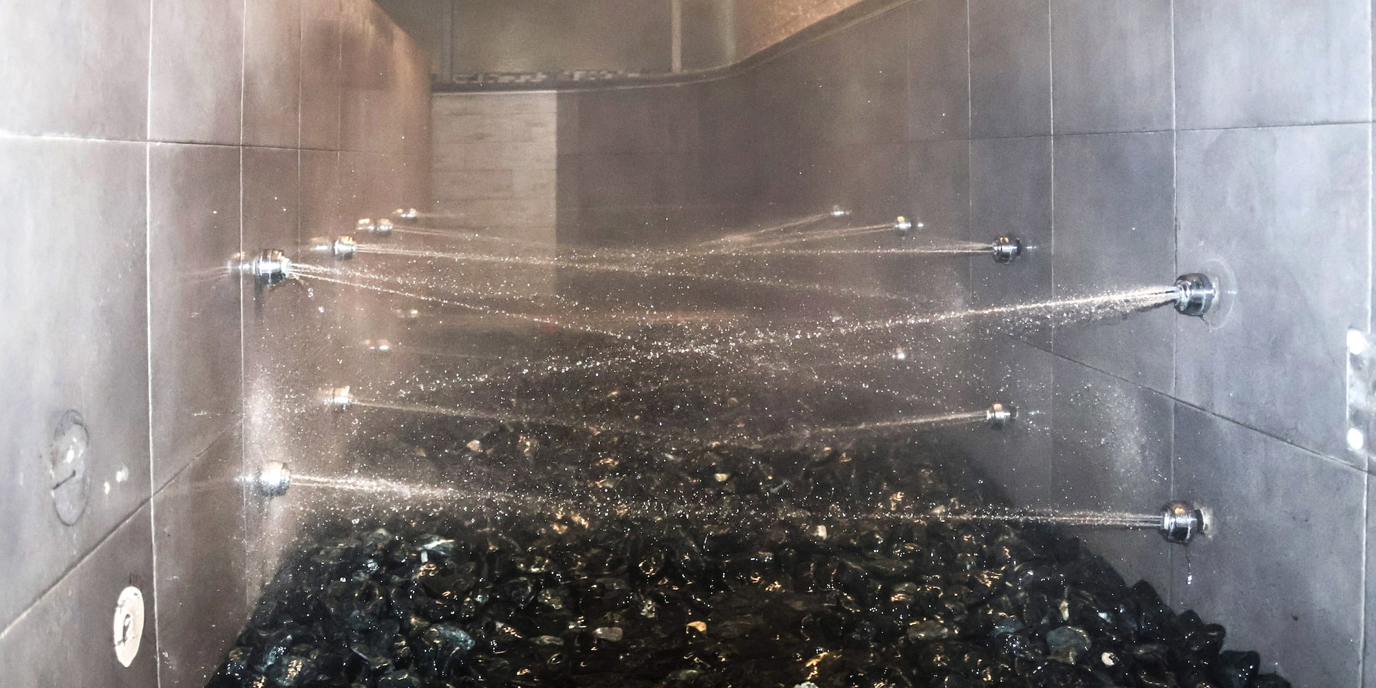 water spraying water into a shower