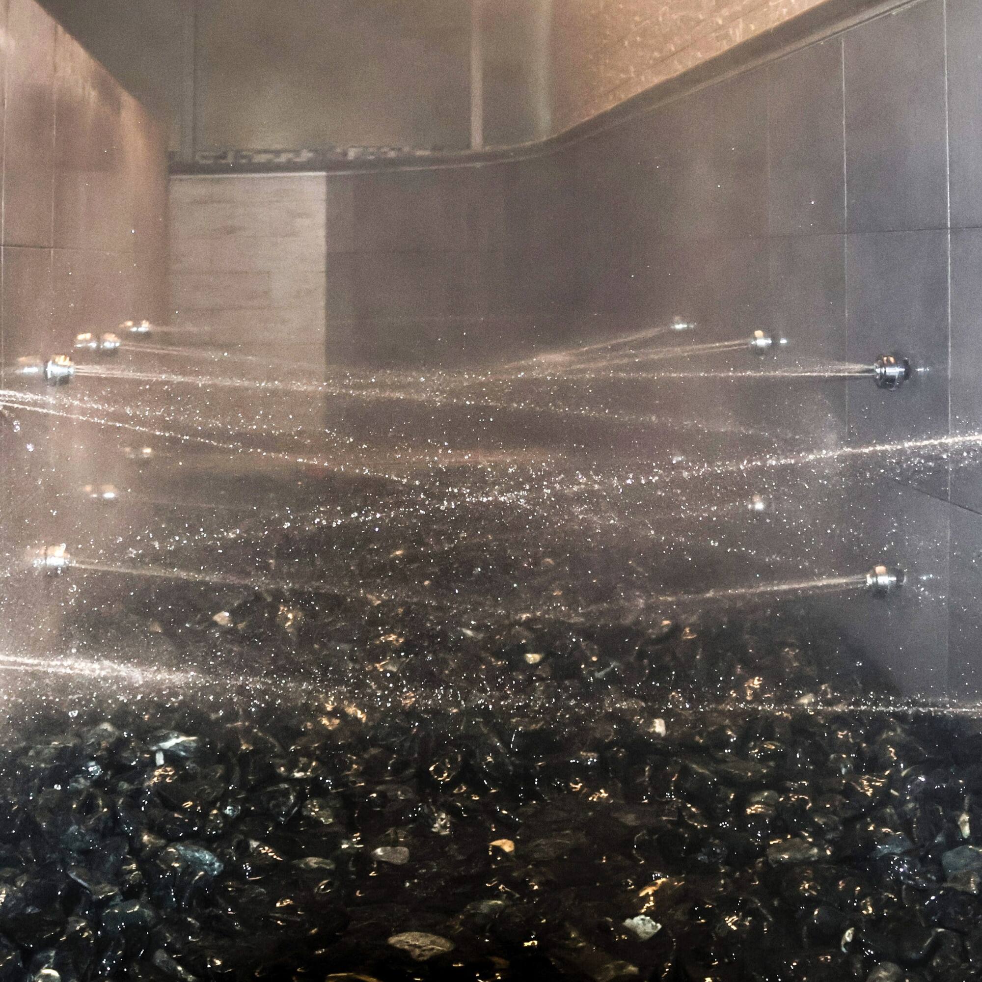 water spraying water into a shower