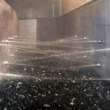 water spraying water into a shower