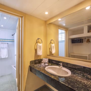 a bathroom with a sink and a shower